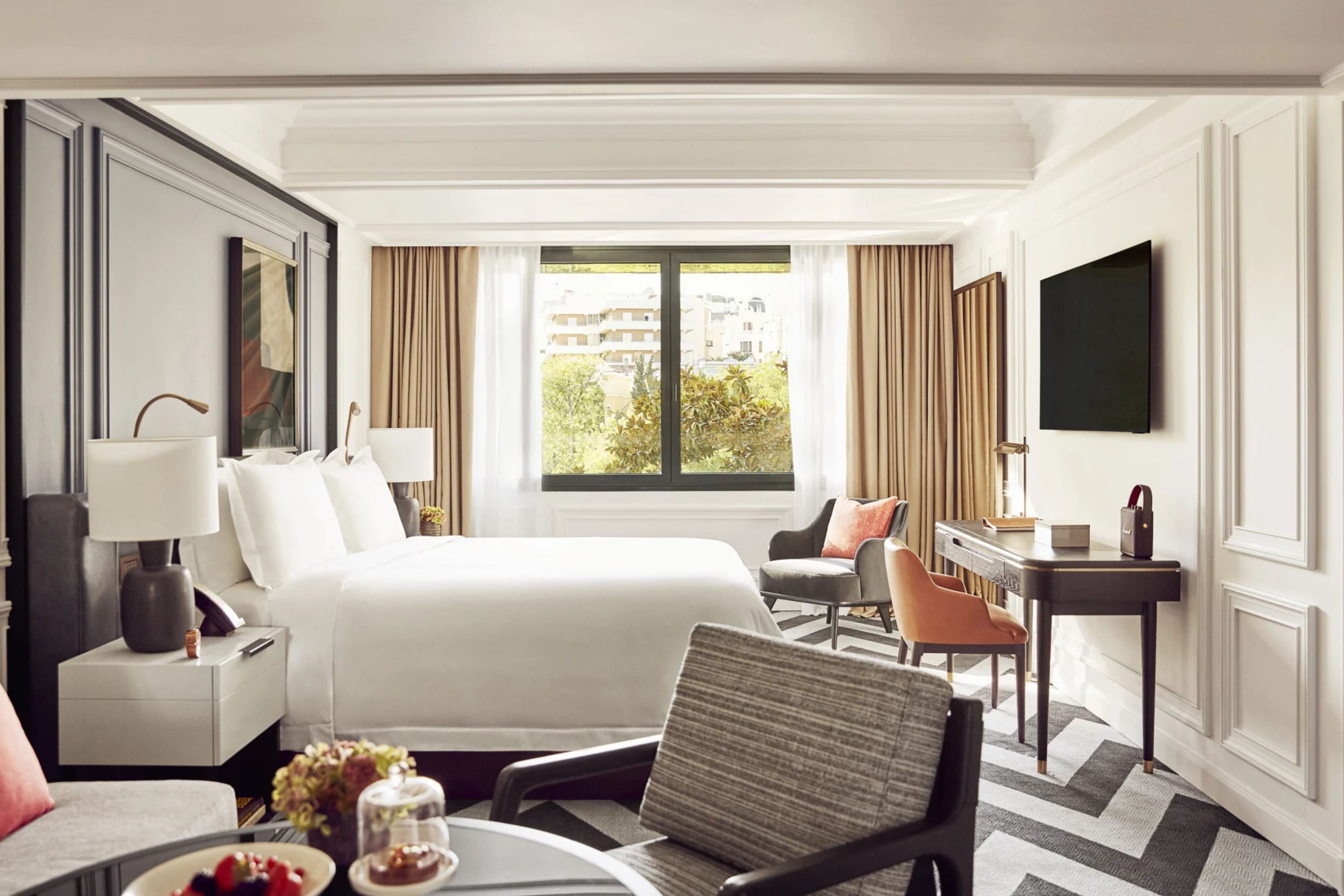 Posh hotel room with abstract flooring, eclectic but high-end decor and a nice view of Salamanca, Madrid