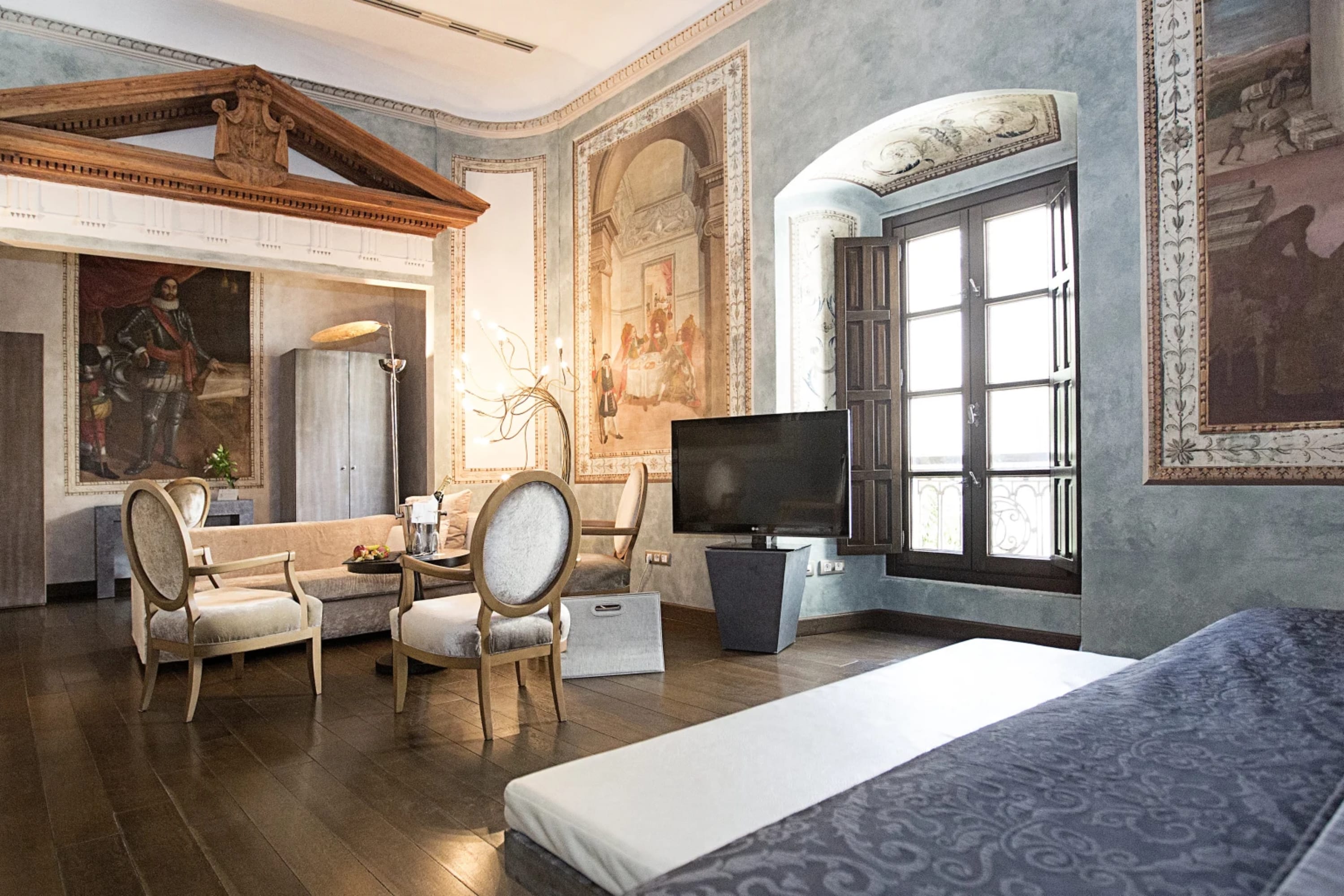 Elegant hotel room with a heavy emphasis on Neoclassical art