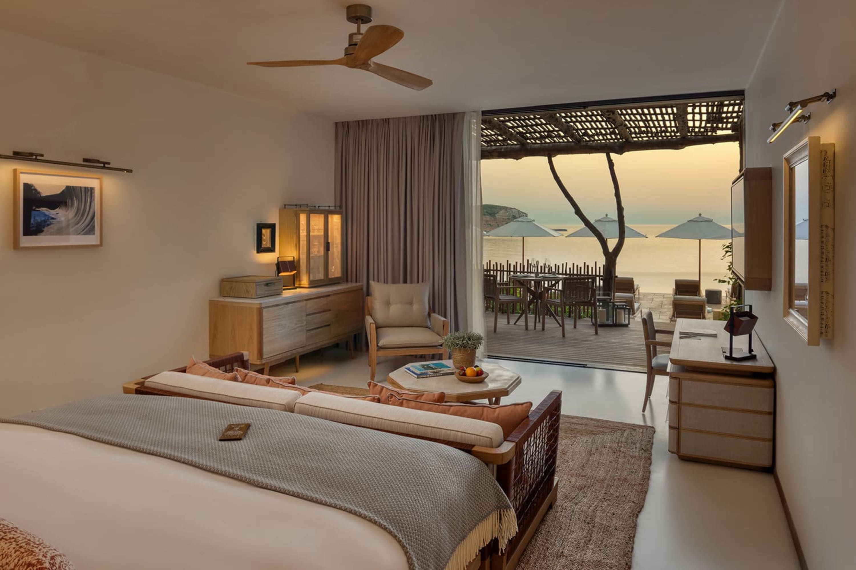 Posh hotel room with an island-rustic aesthetic and a stellar view of Ibiza Bay