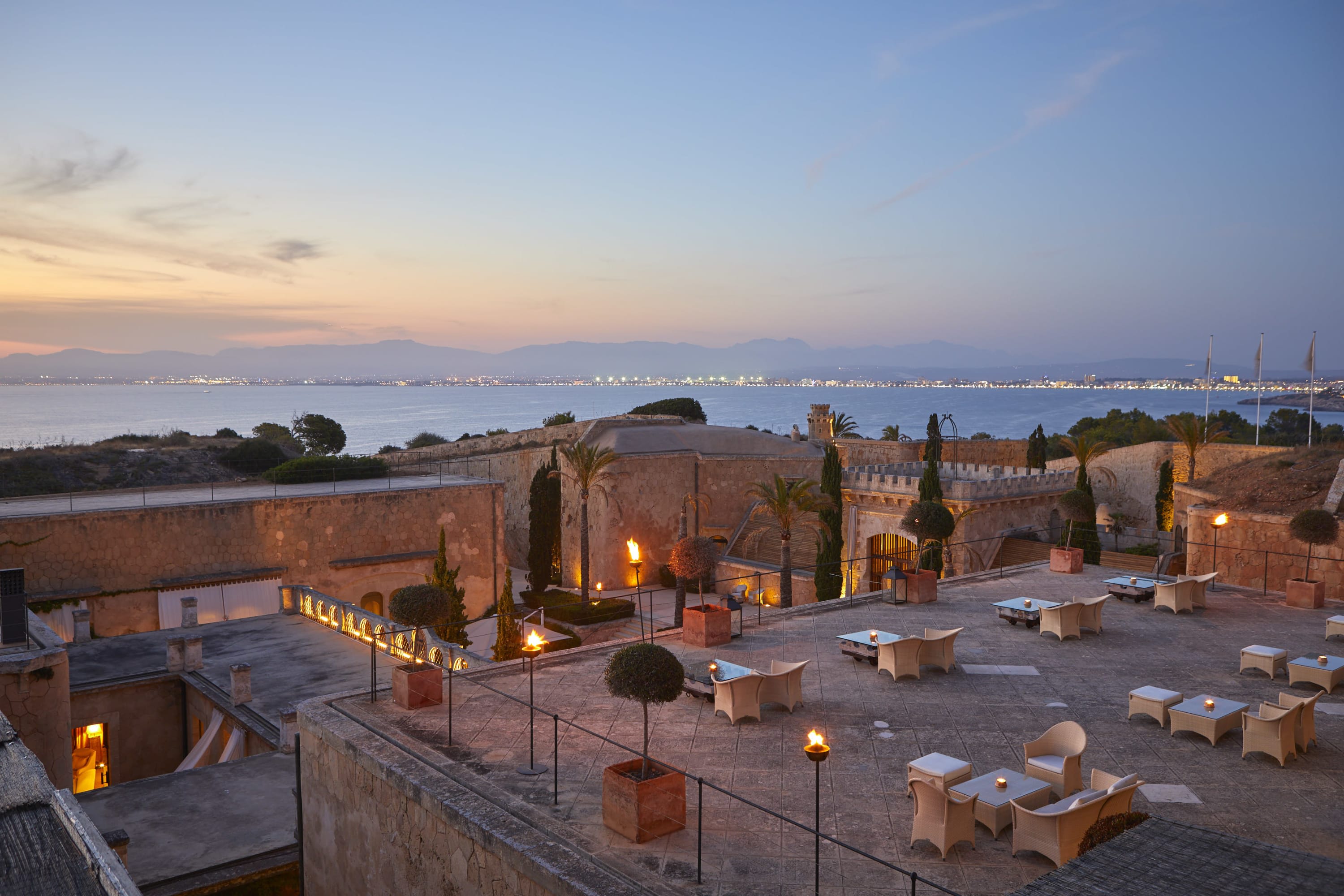 A high-end restaurant built into a stone fortress with a view of the Mediterranean Sea
