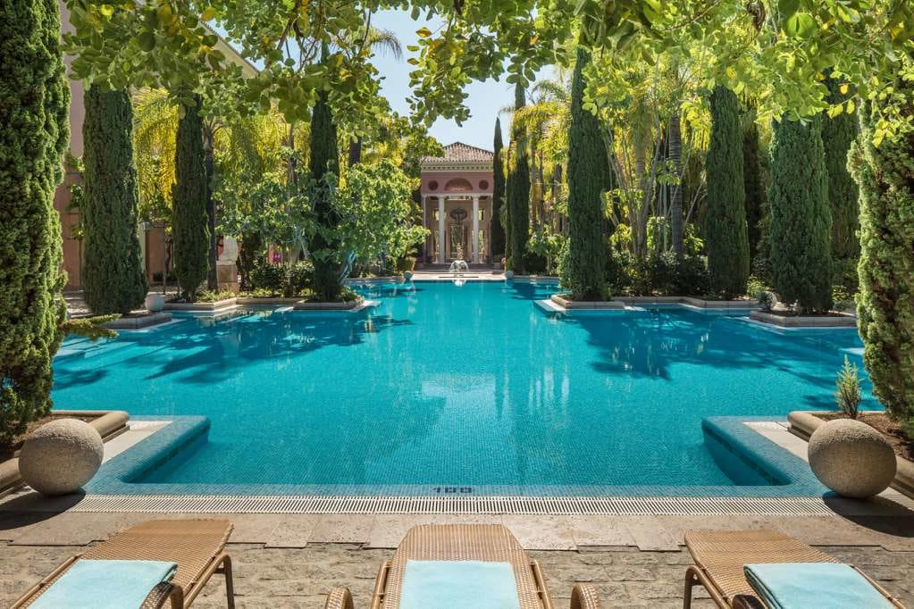 Posh pool area with stately gardens