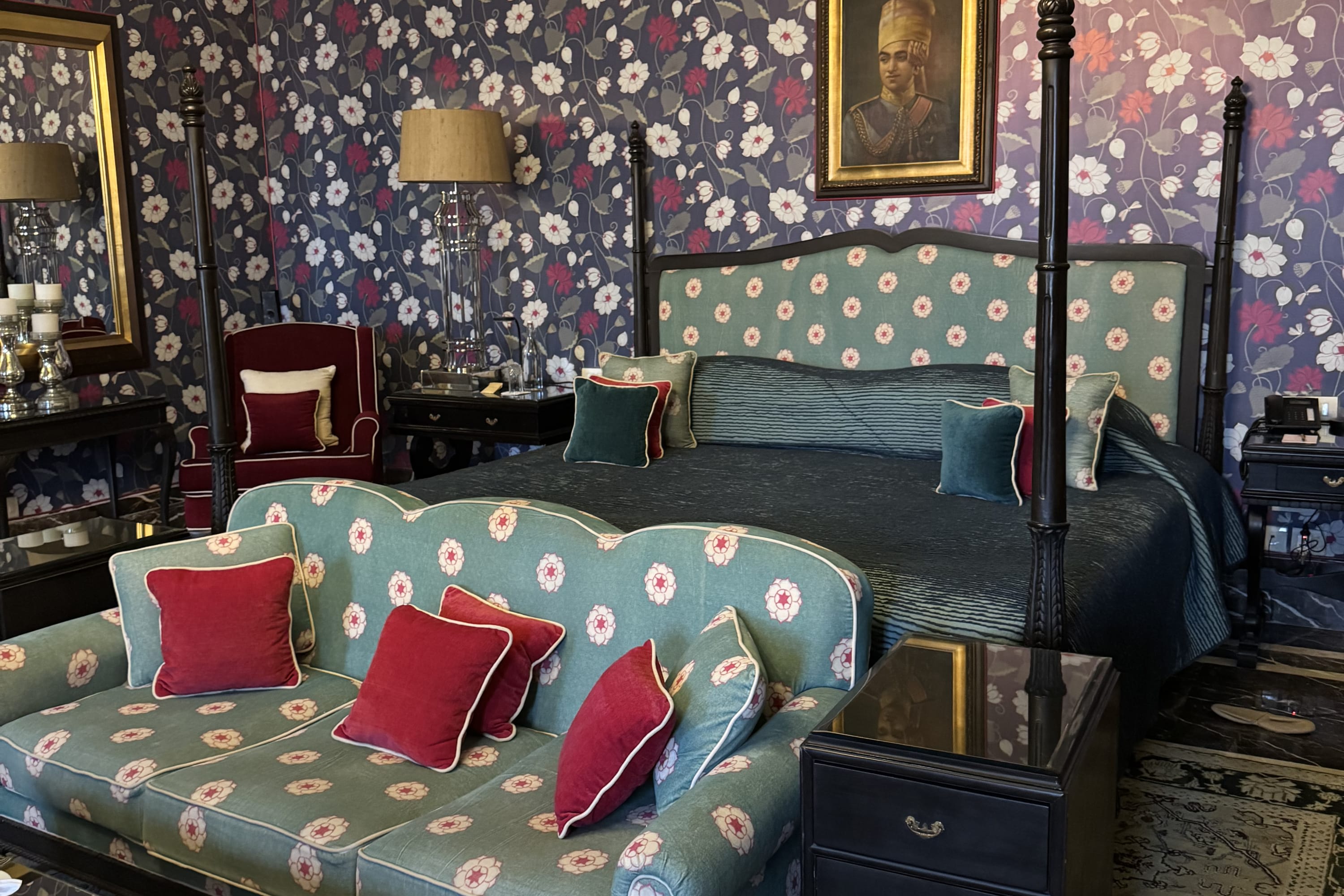 A bold color palette of teals and blues contrast in an elegant hotel suite