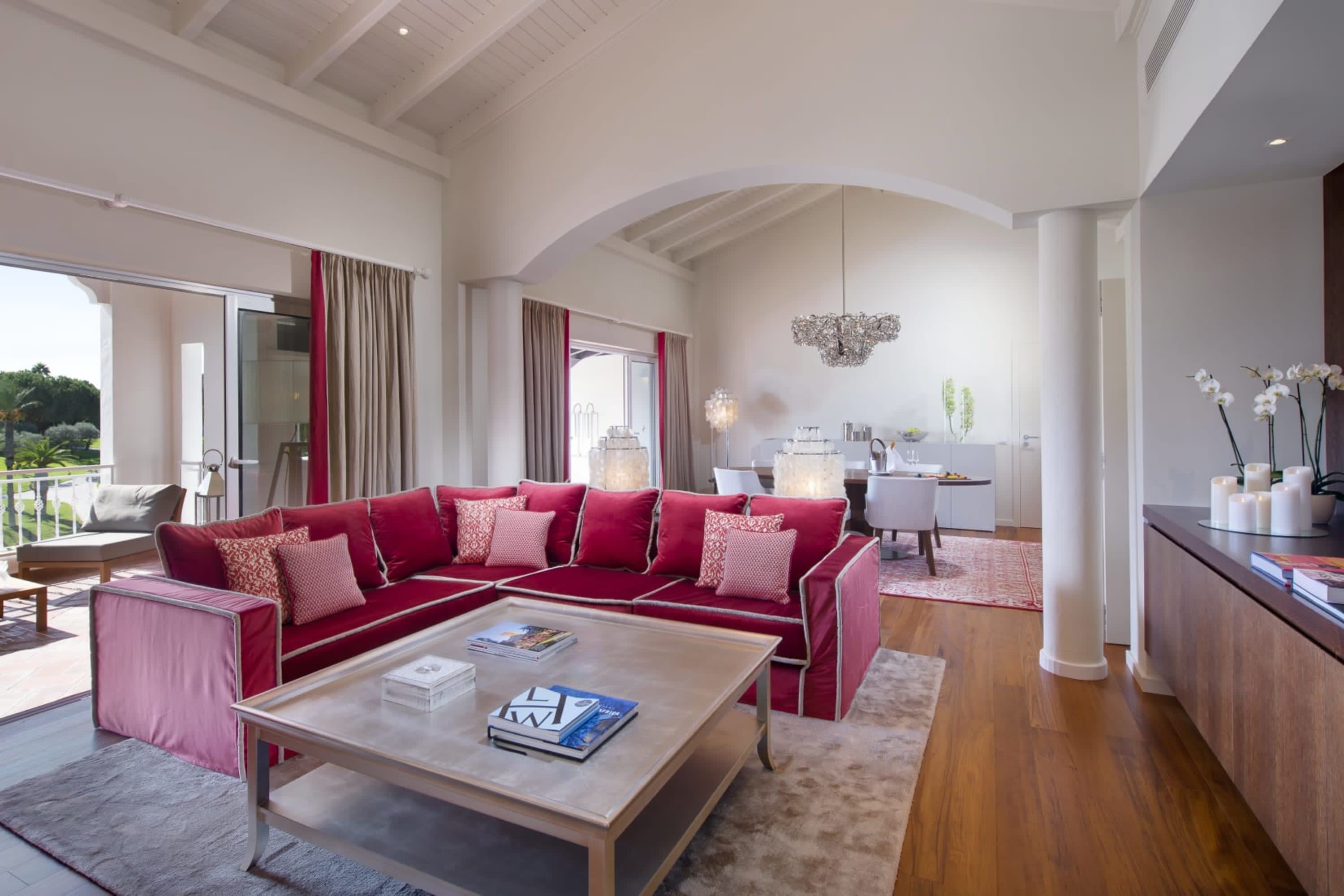 Spacious and airy suite with an indoor/outdoor living area and elevated views of the resort grounds