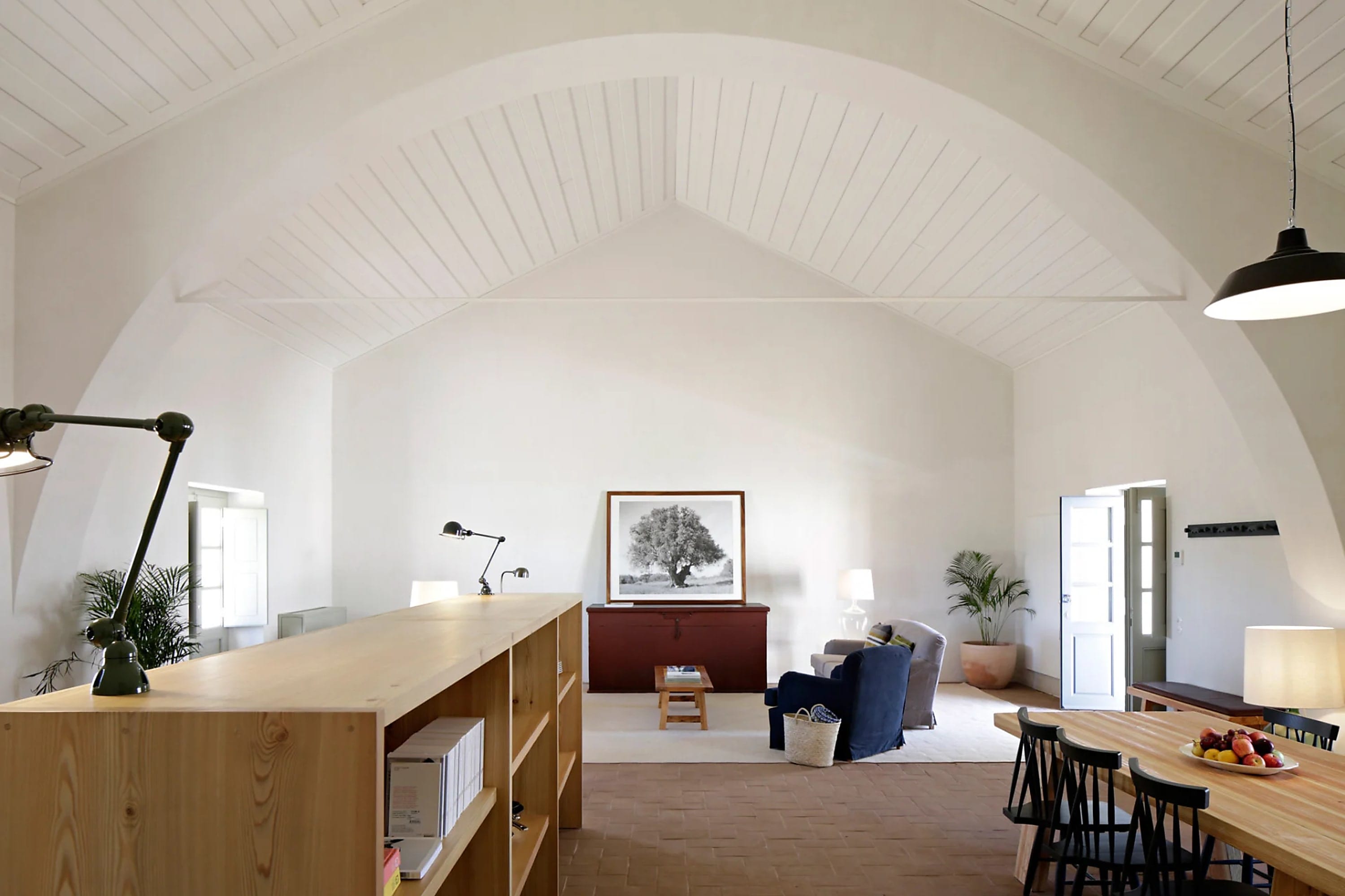 Chic-rustic decor and furnishings in an exceptionally spacious living area under a dome-like ceiling