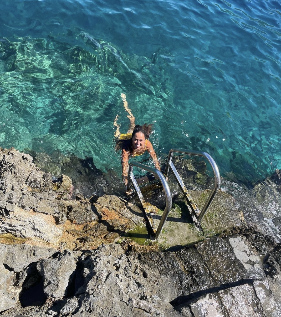 Swimming in blue sea.