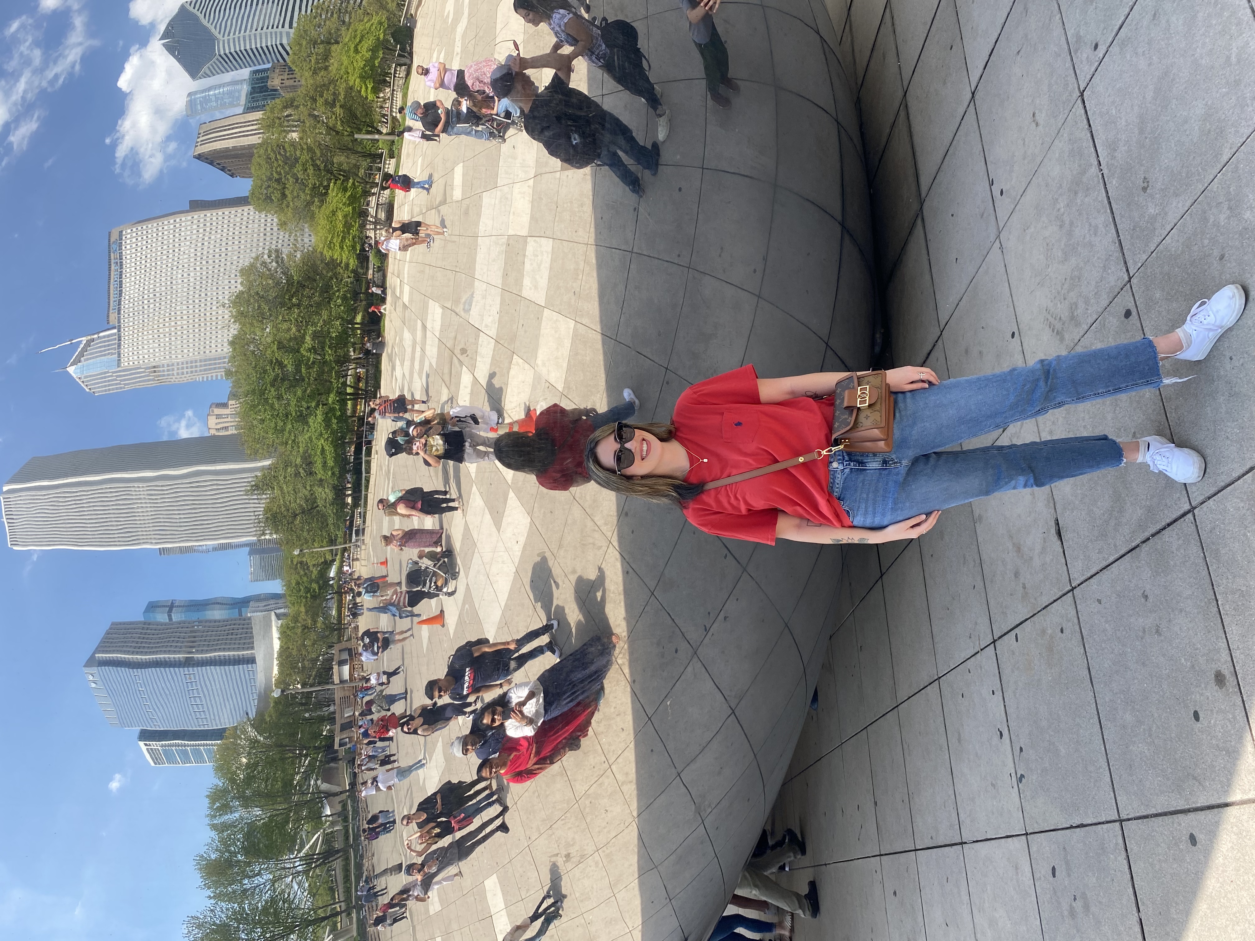 Advisor posing for an image outside the Bean in Chicago.