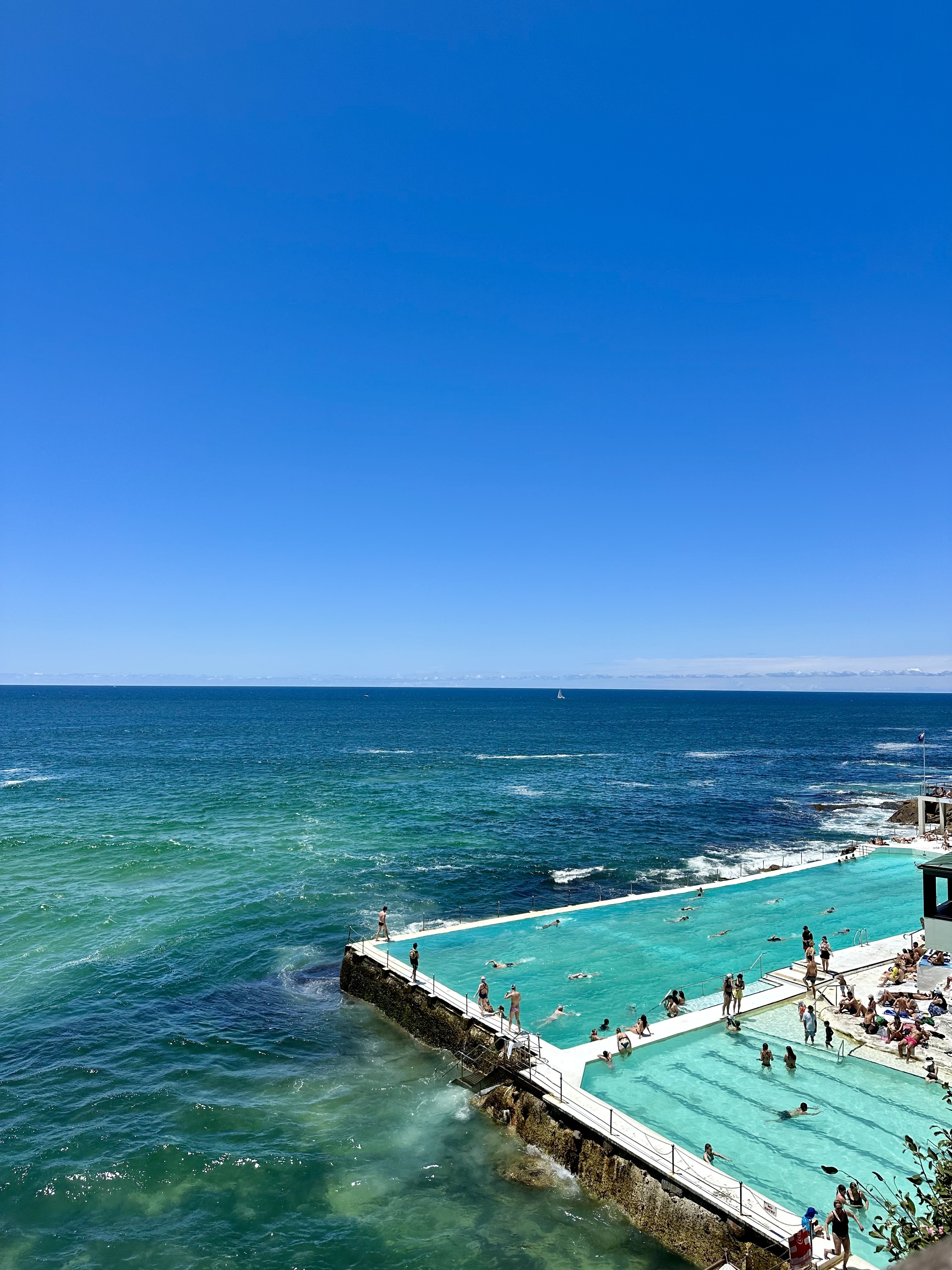 View of the Bondi Beach infinity pool on a sunny day in Australia