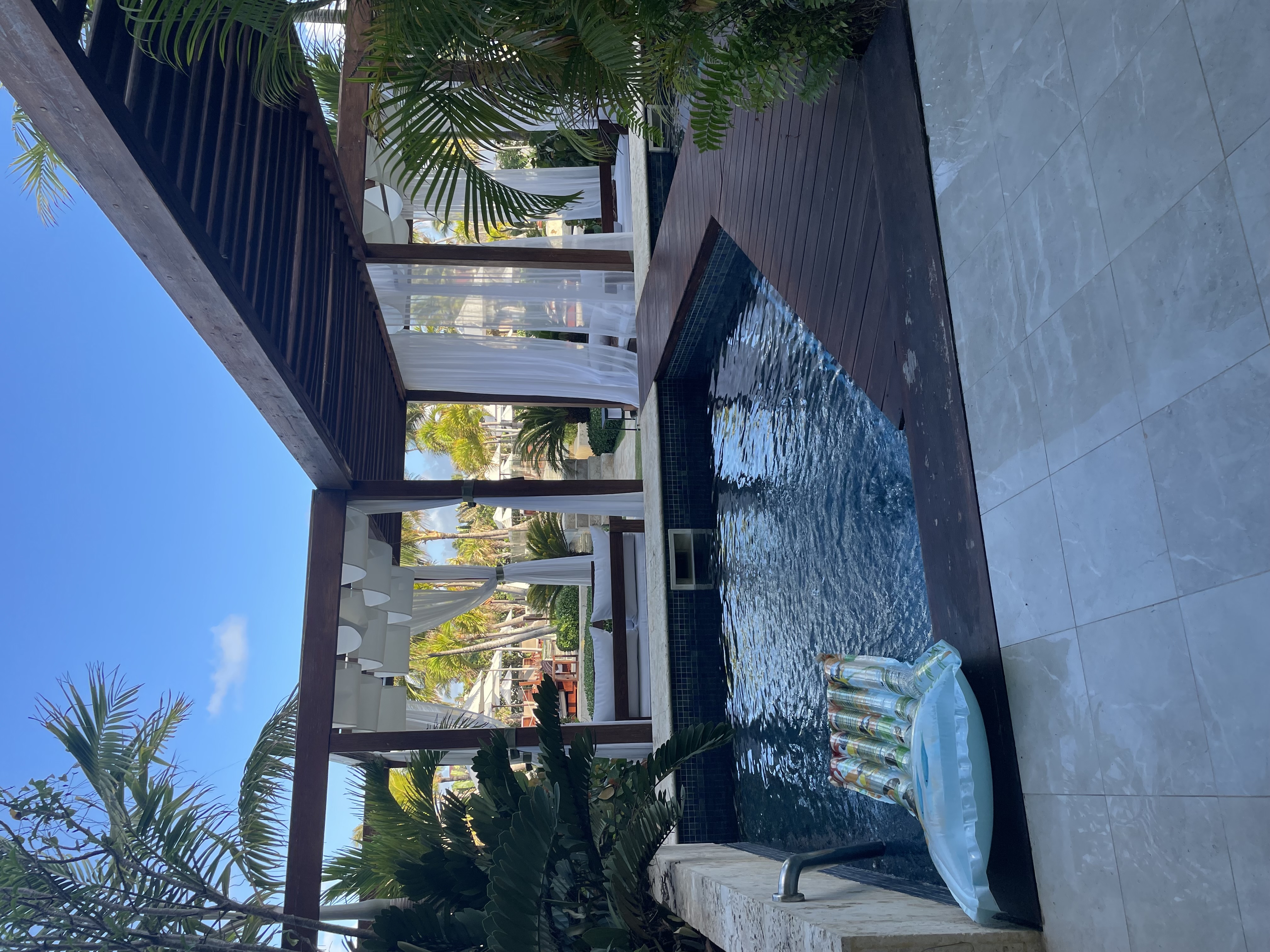Pool on the patio of a hotel.