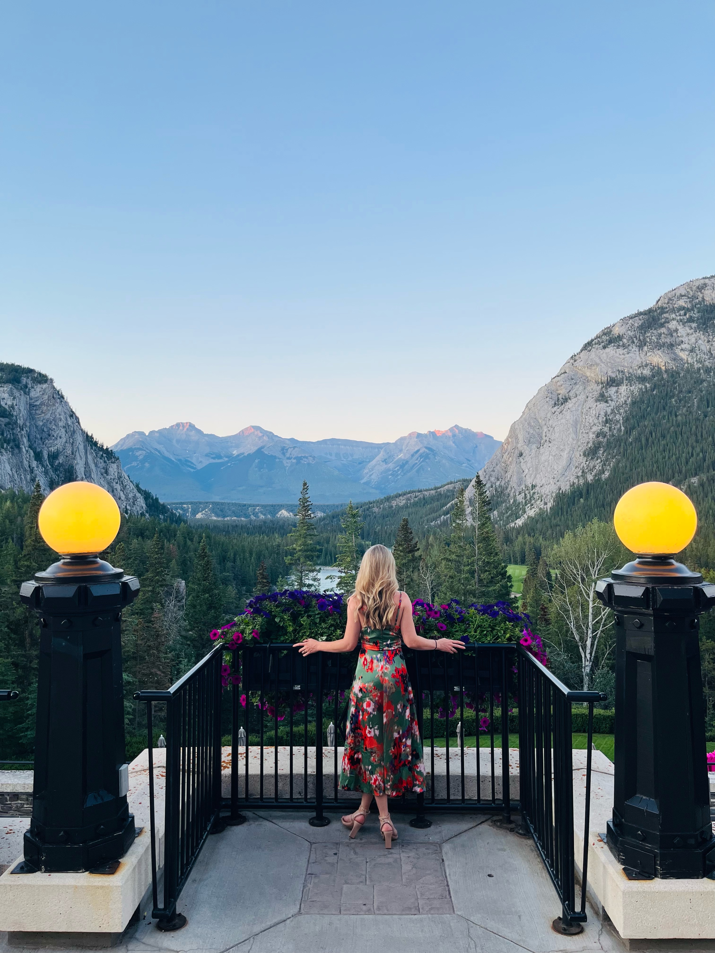 Viewpoint overlooking blue skies and mountainous terrain.