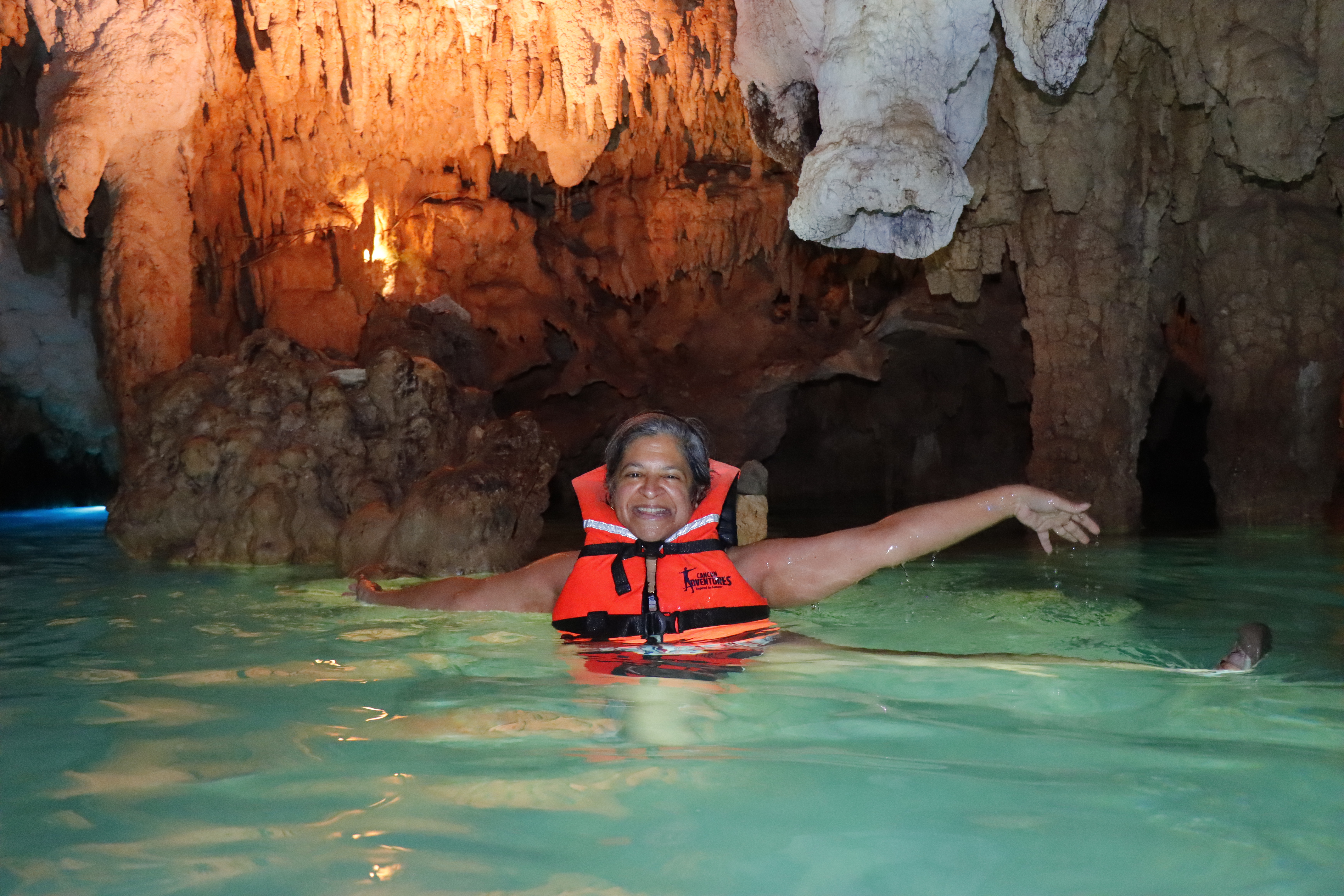 Advisor posing in a cavern.