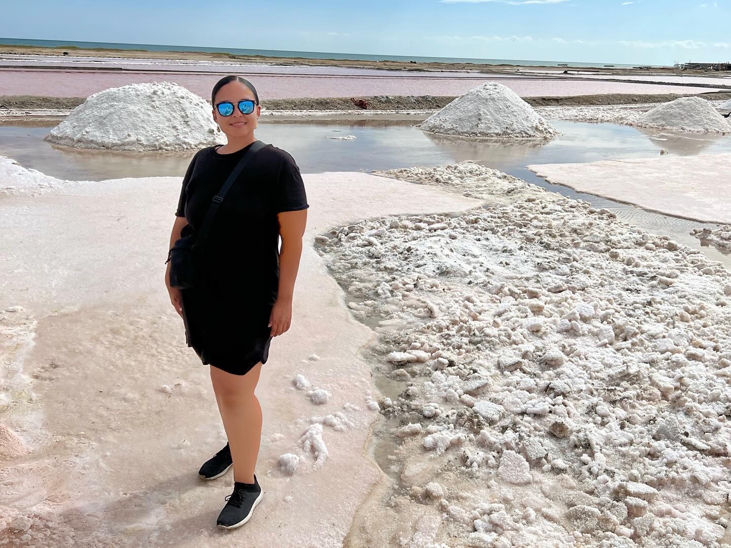 Standing by white plaines in rocky terrain.