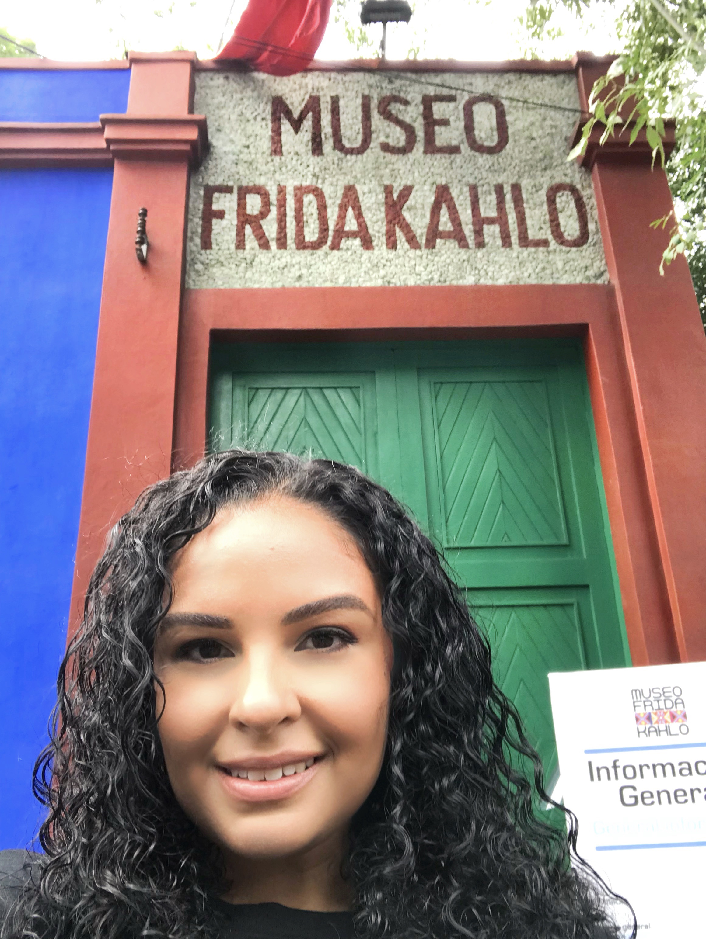 In front of a colorful doorway.