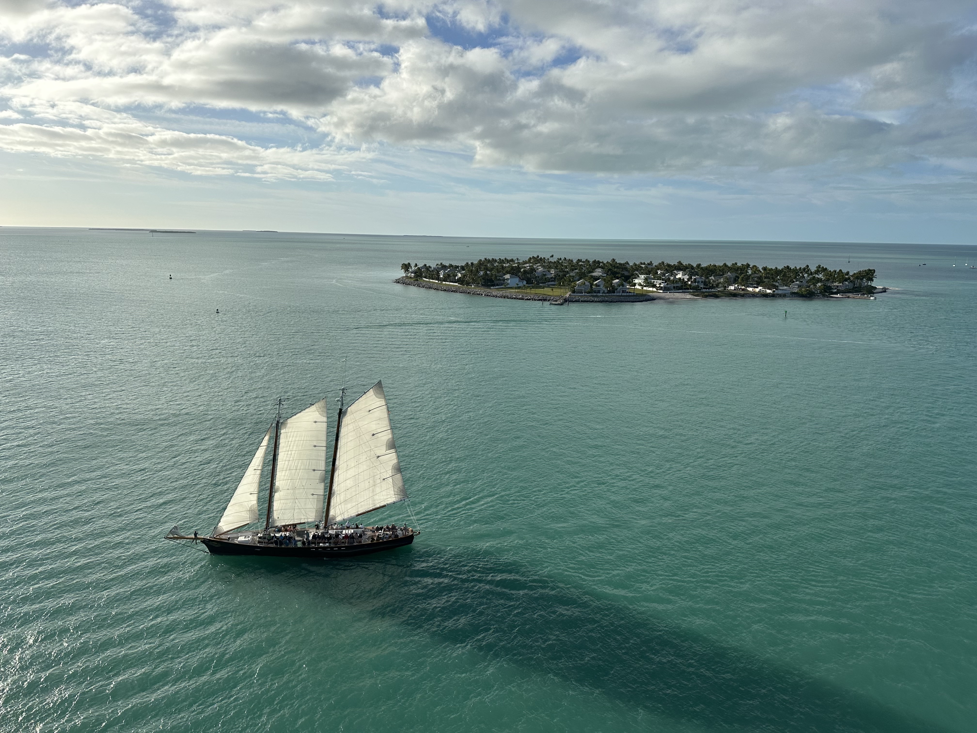 Aerial view of a large sailboat at sea under sunny skies in Key West, Florida
