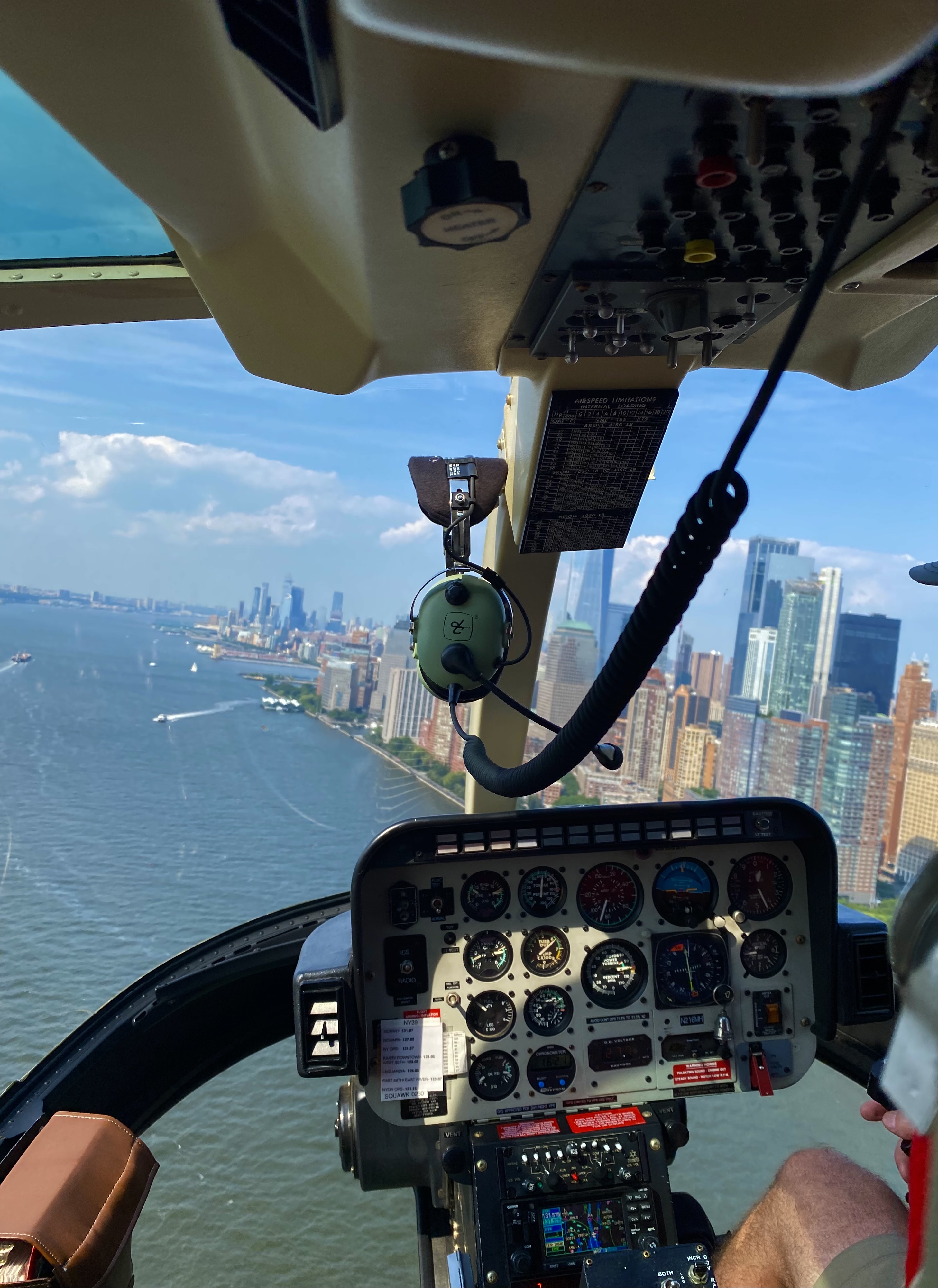 View of a city skyline as seen from above in a helicopter