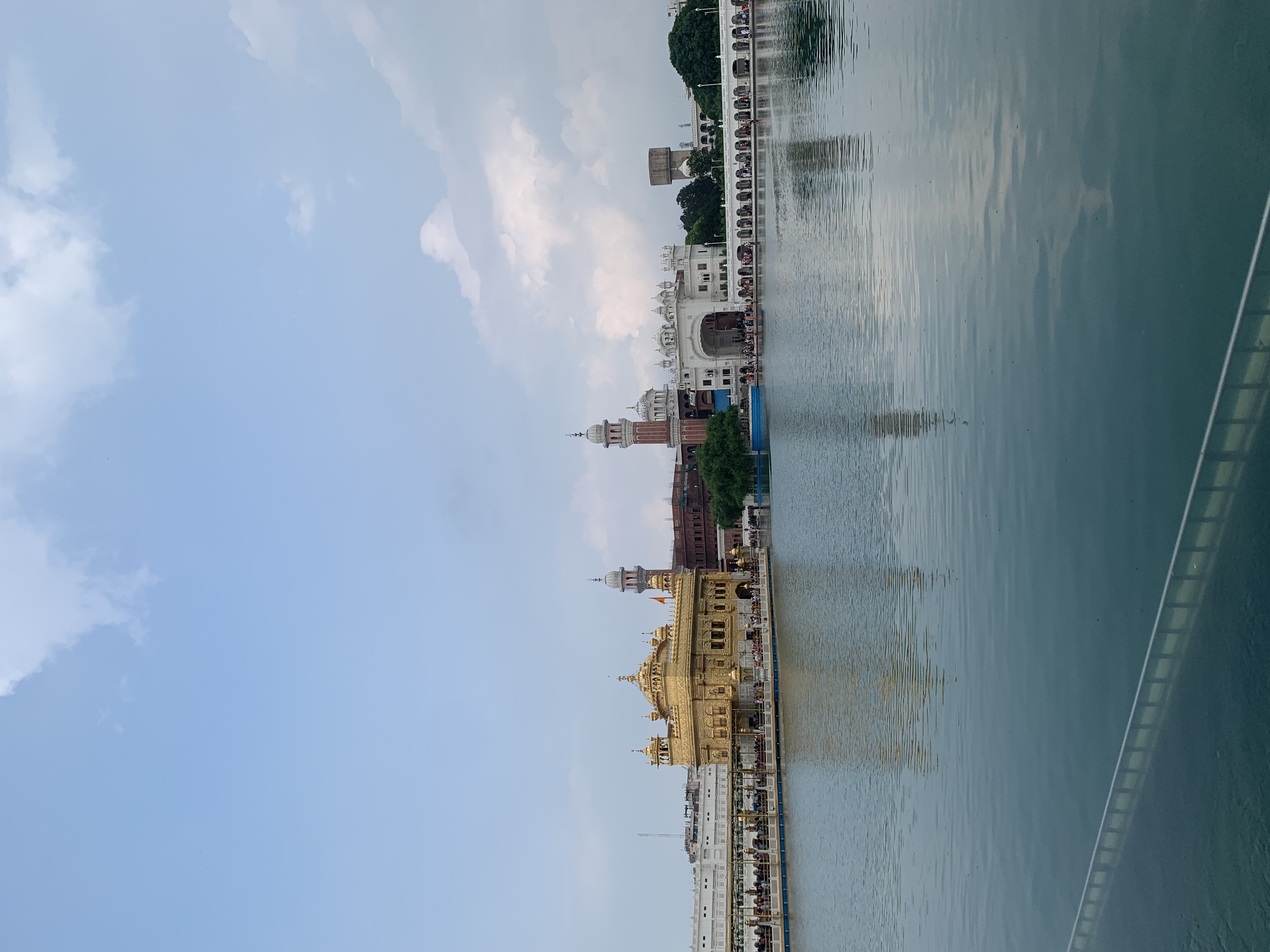 A body of water with buildings across the way during the daytime.
