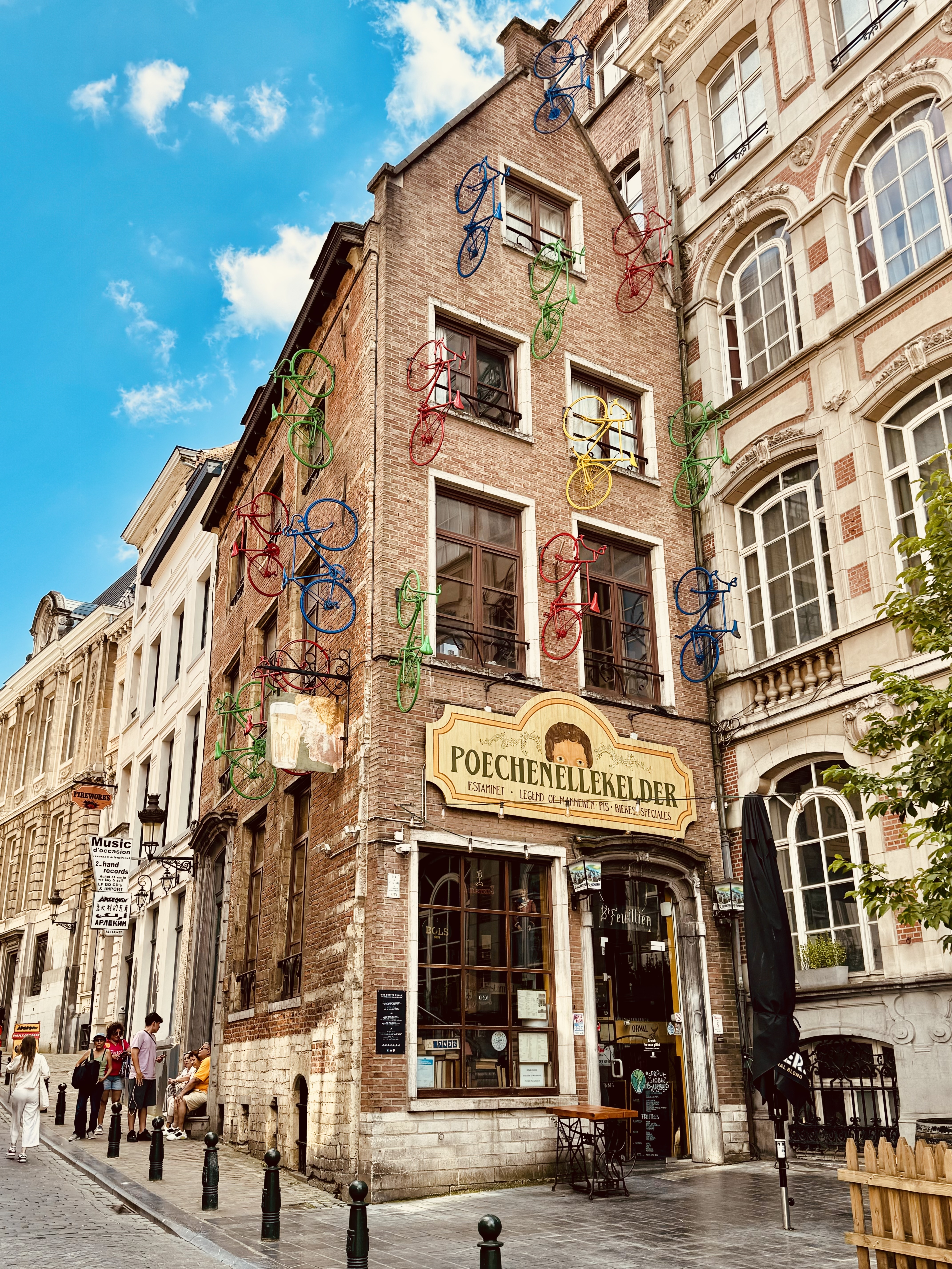 View of a old city street lined with pretty buildings on a sunny day