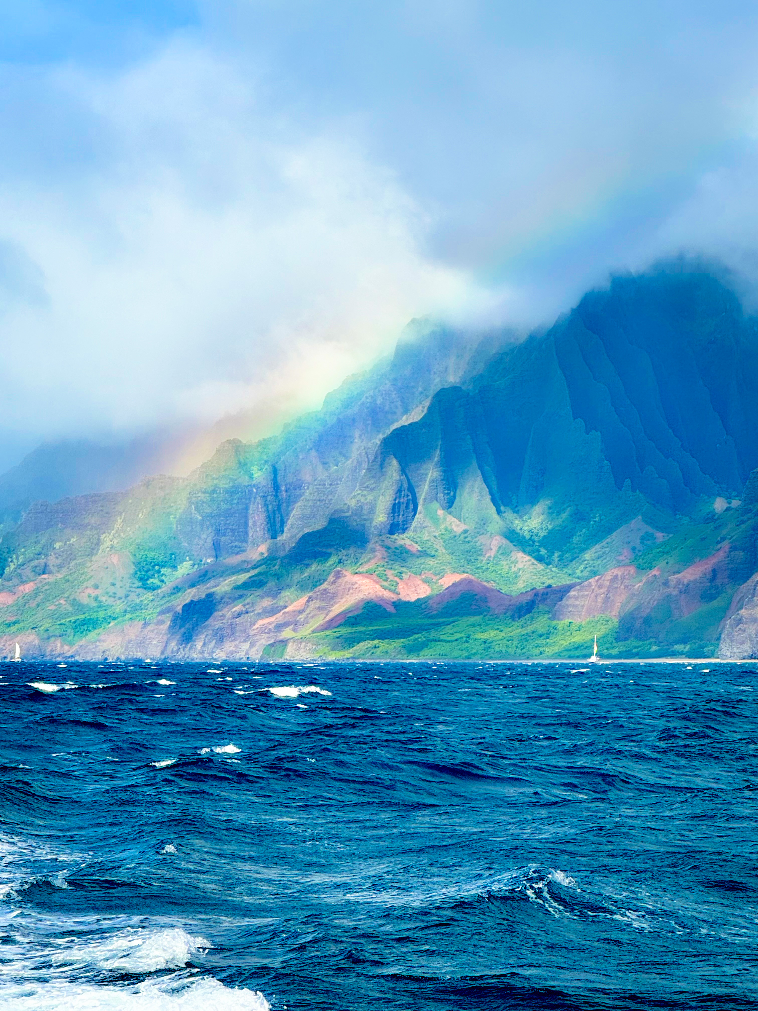 Rainbow over the mountains and sea.