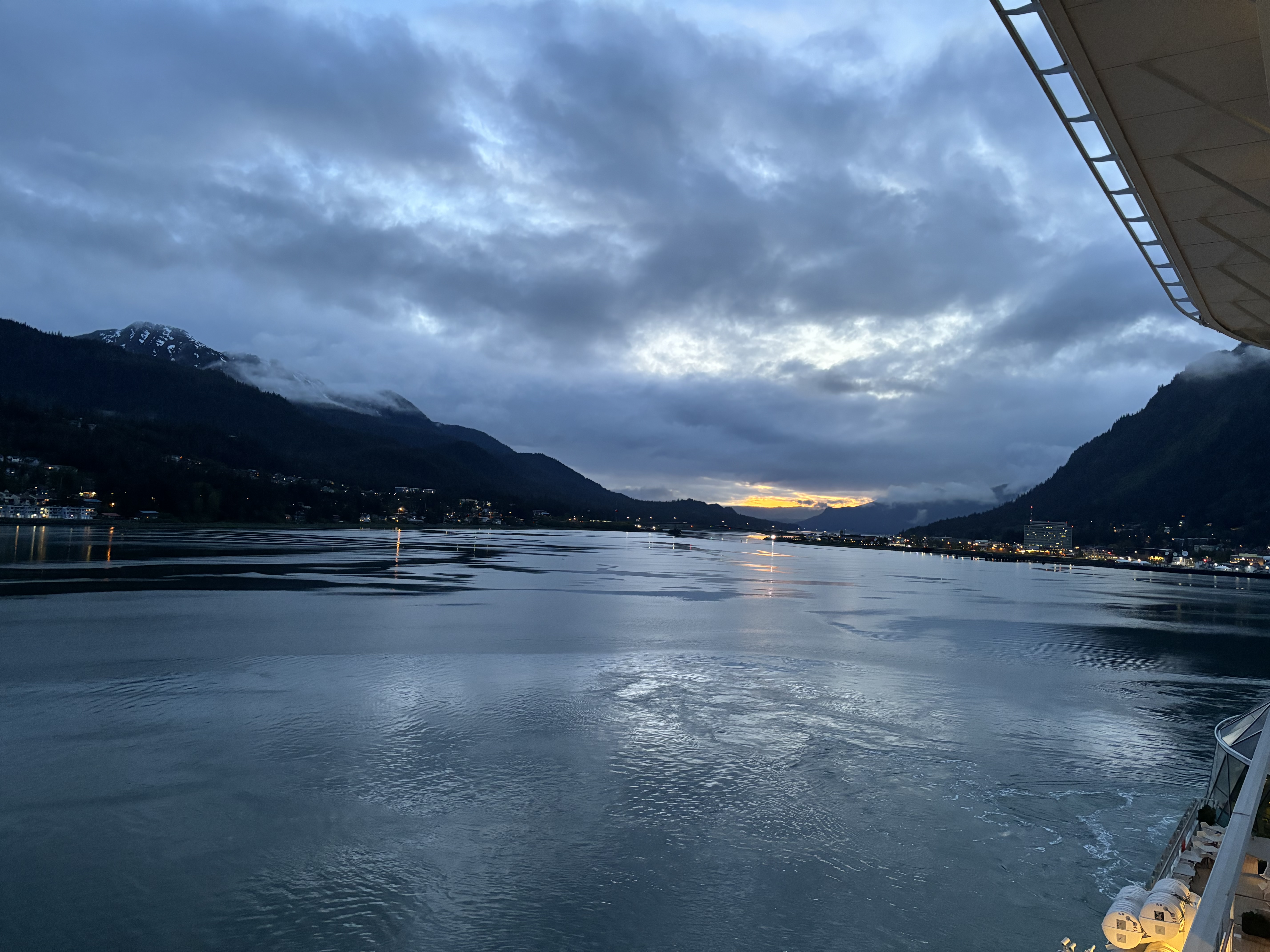 A view of a body of water a dusk.