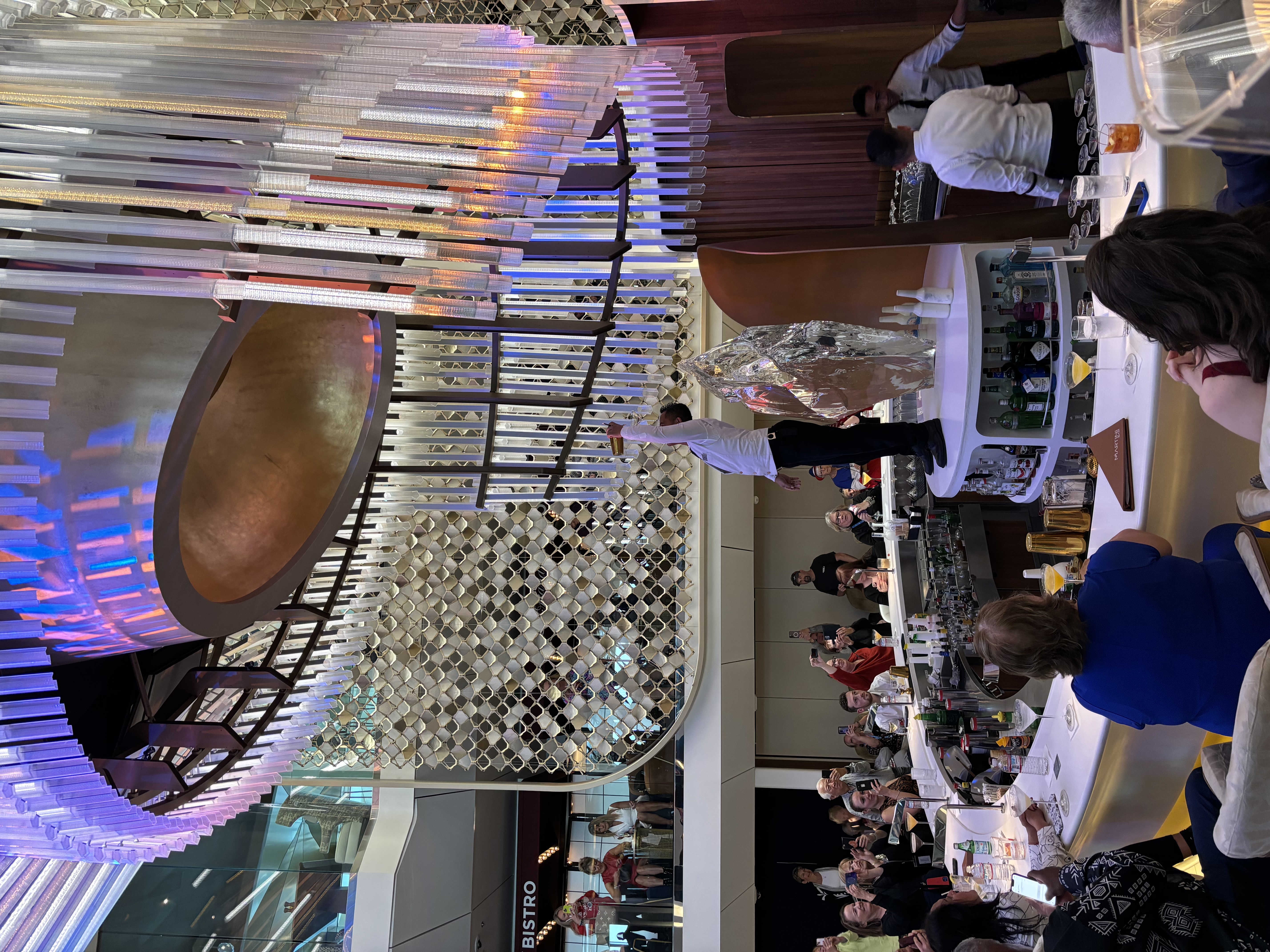 A view of a grand ballroom on a cruise ship.