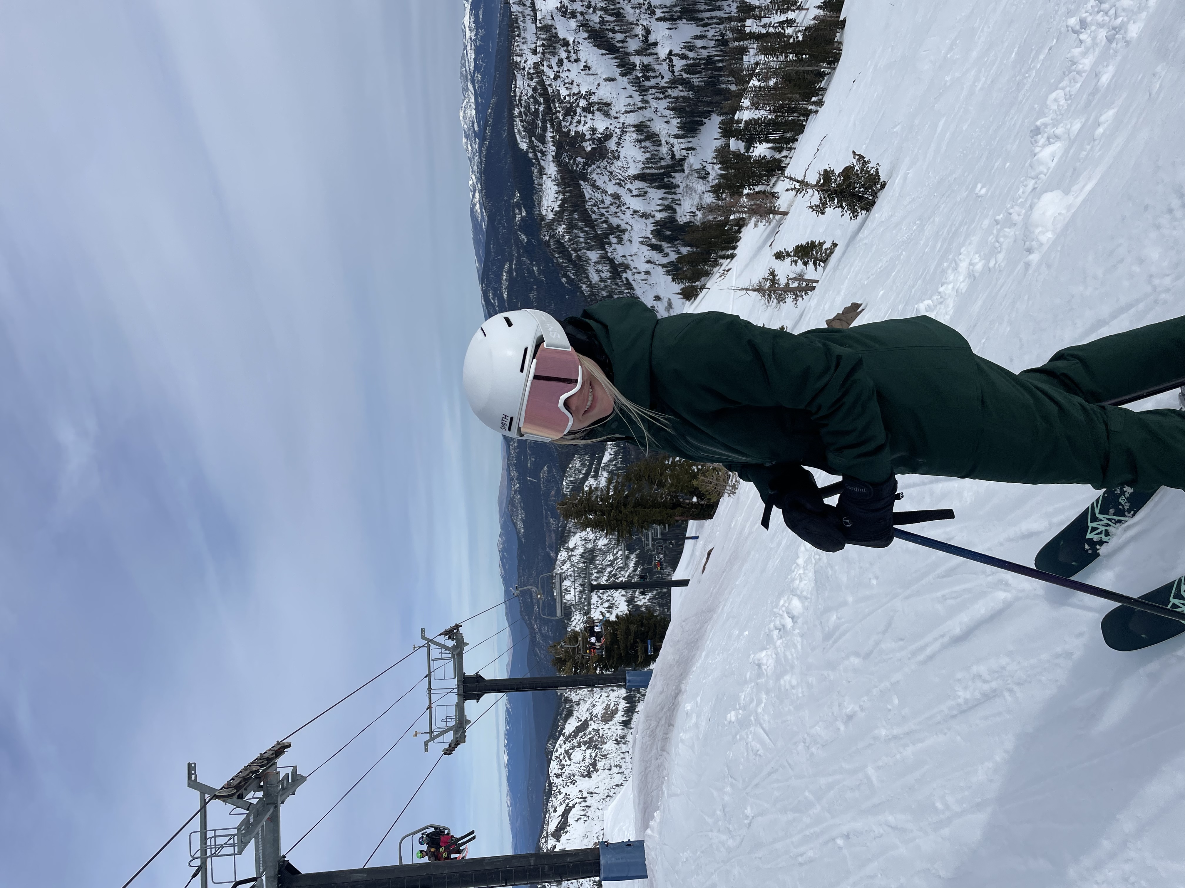 Advisor in ski gear and goggles on the slopes