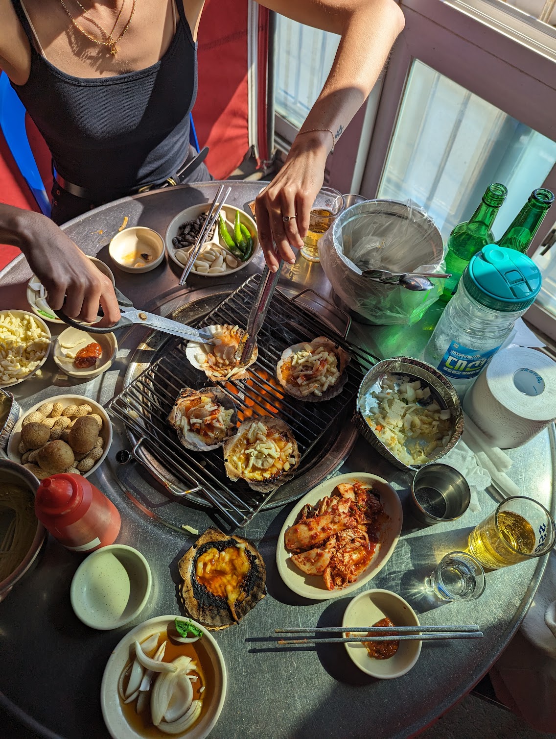 Overhead view of a round table set with various plates of food