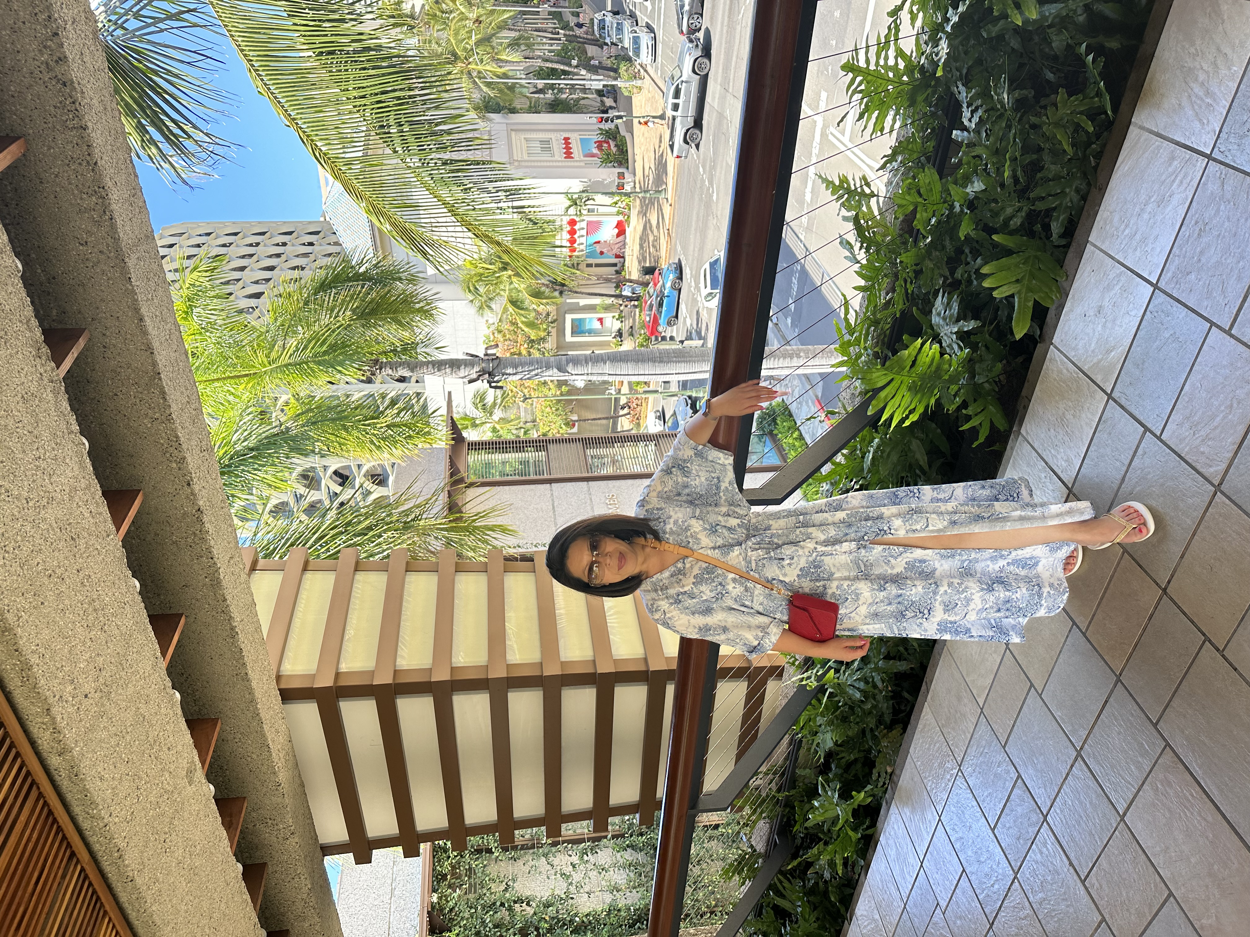 Advisor in a long dress standing outdoors on a sunny day