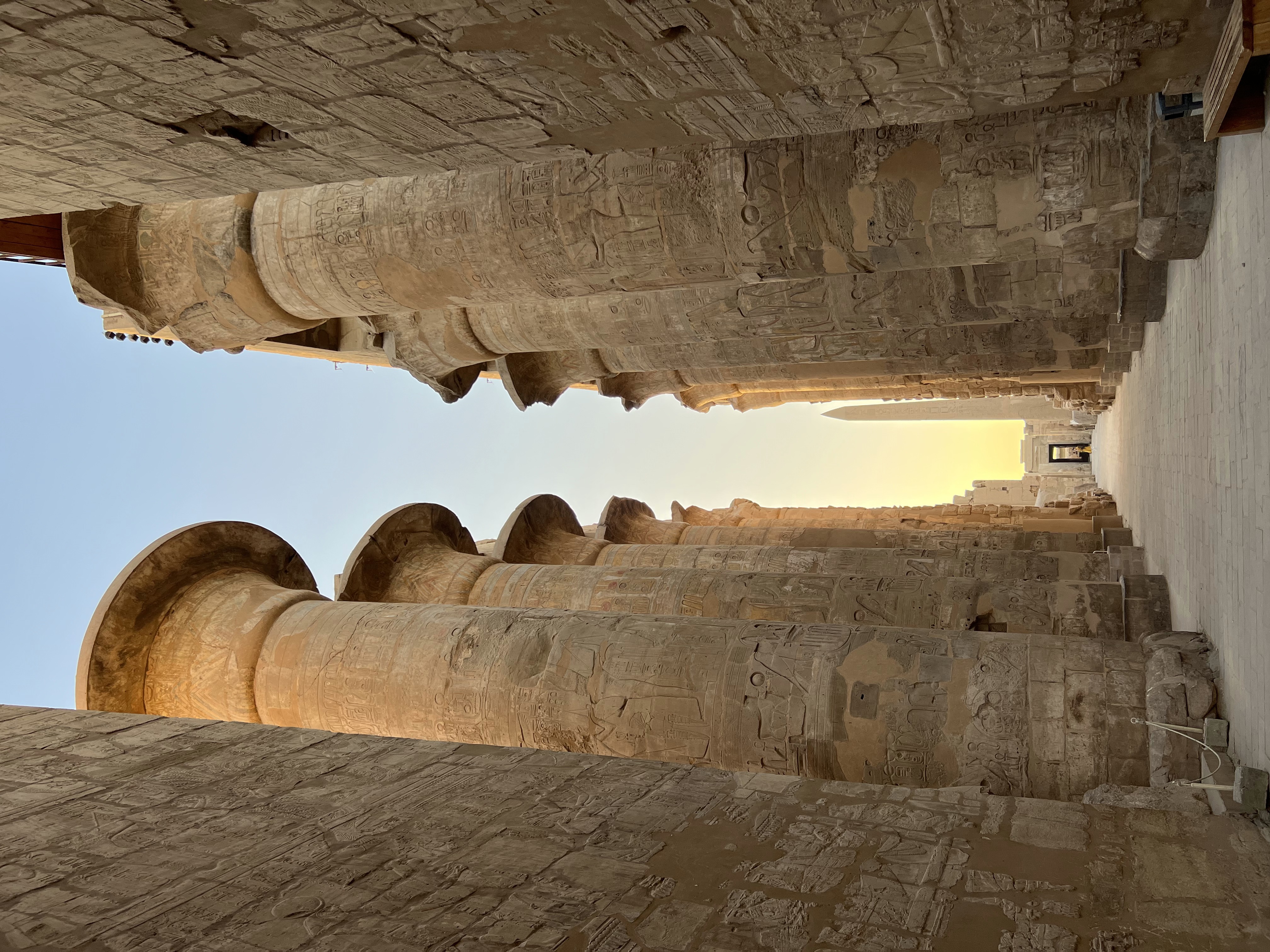 Large stone pillars lining a path.