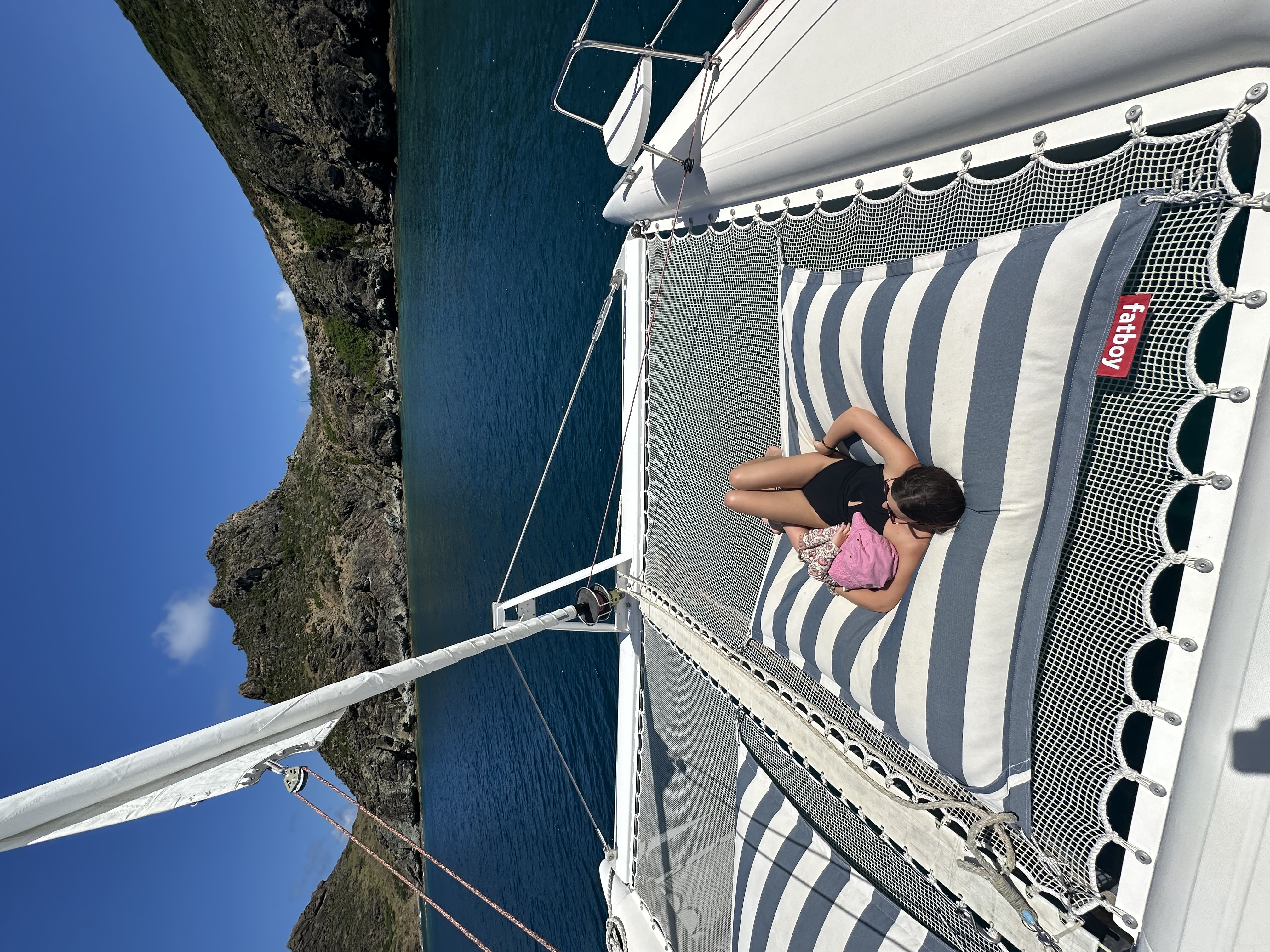 Advisor sunbathing on a yacht in the ocean on a sunny day.