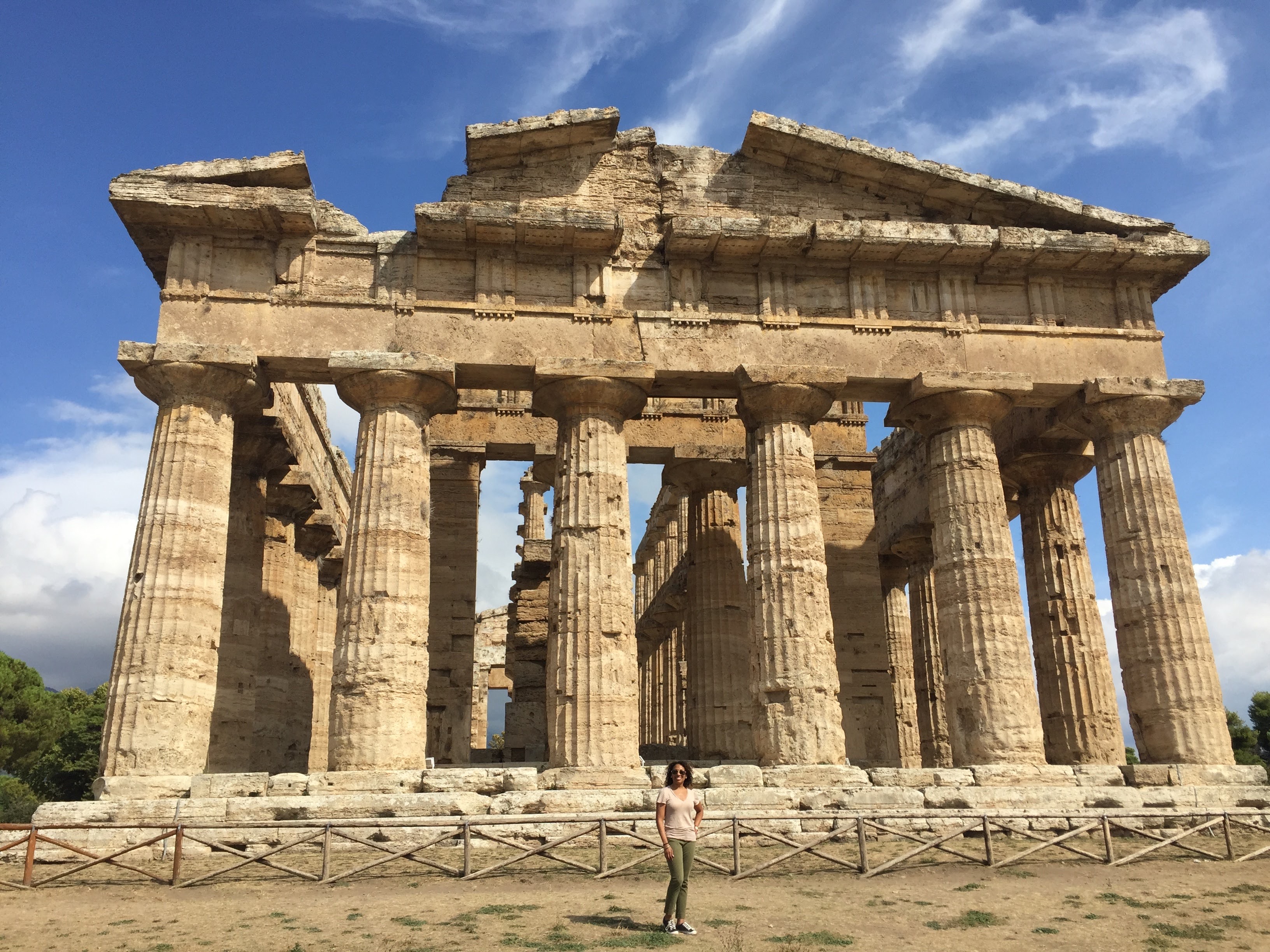 View of ancient ruins with large columns on a sunny day