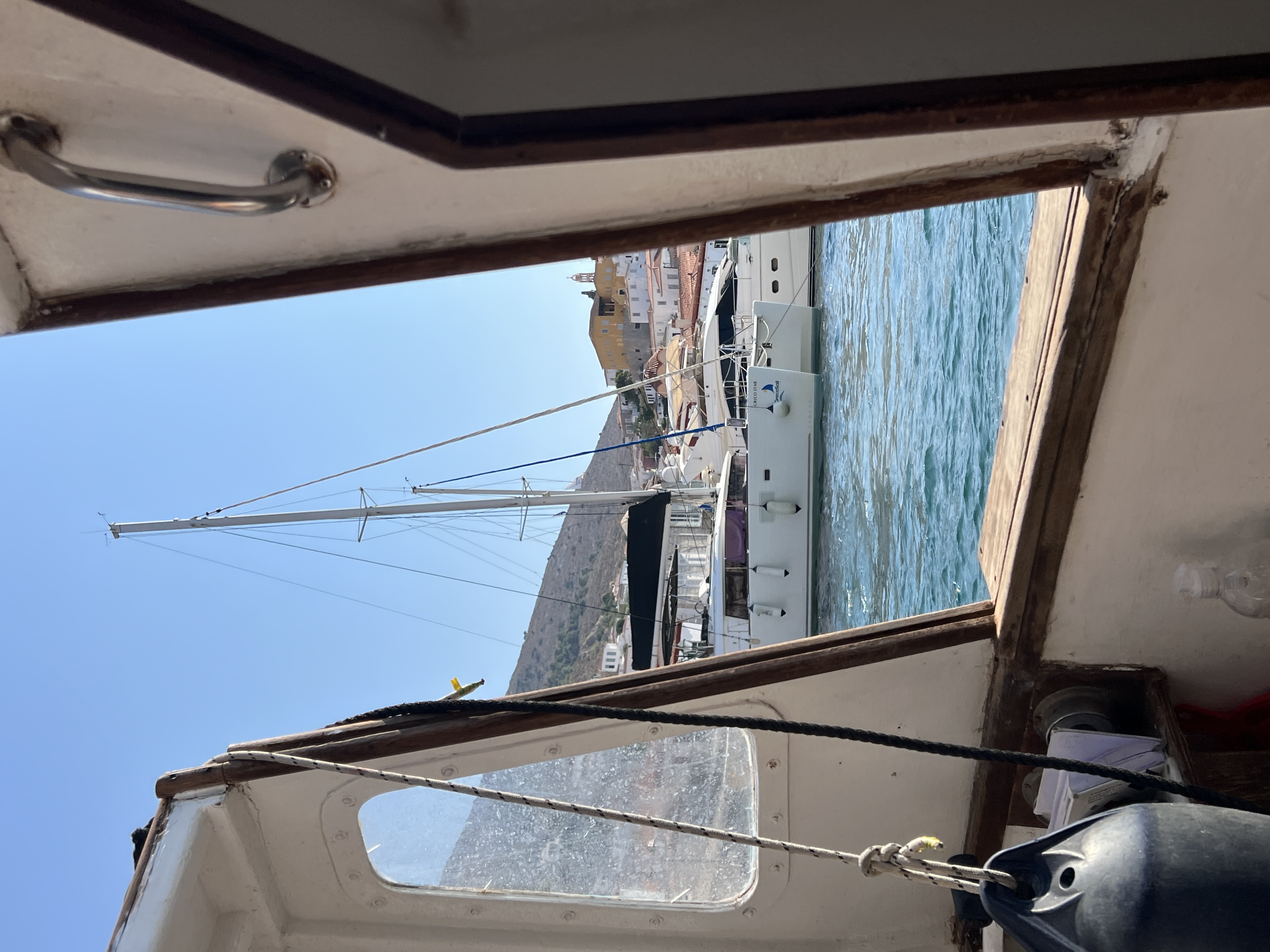 View of a boat seen from the side of another boat on a sunny day