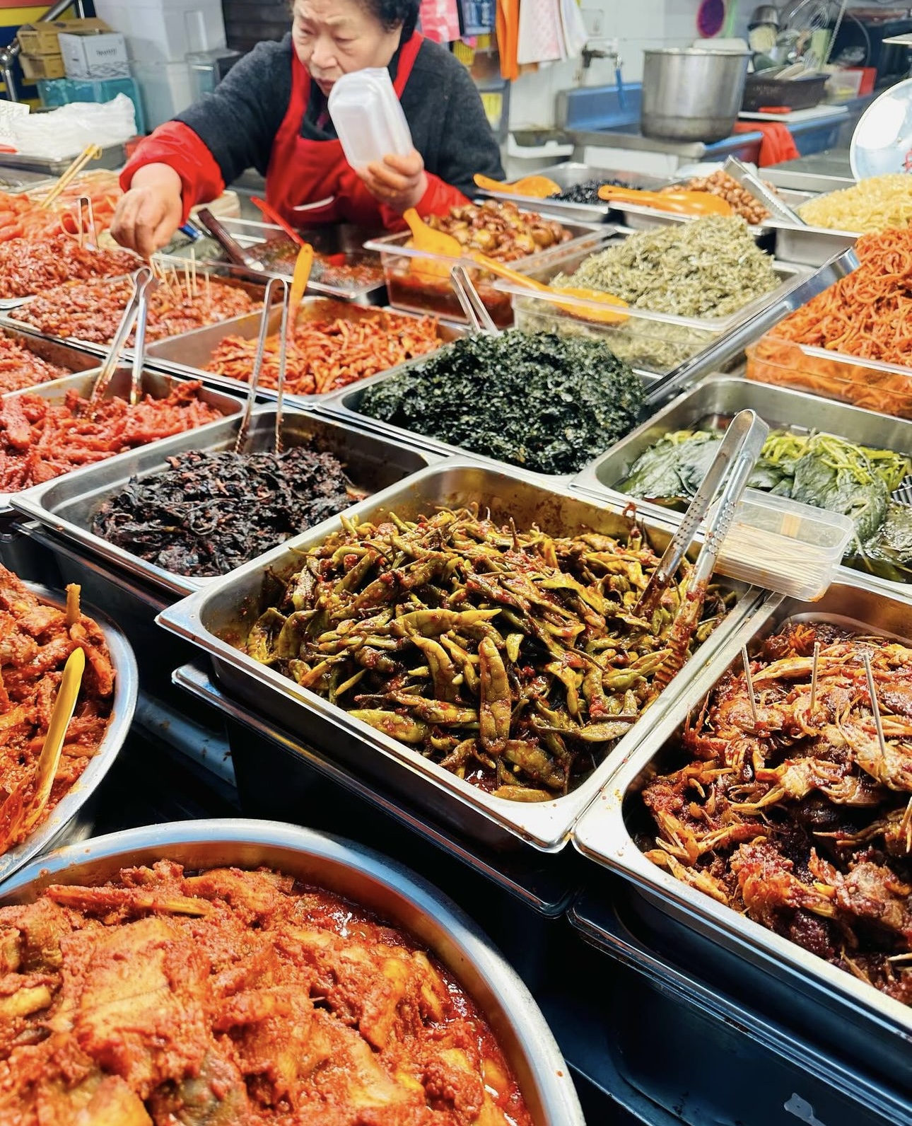 View of trays of food at an outdoor market at night