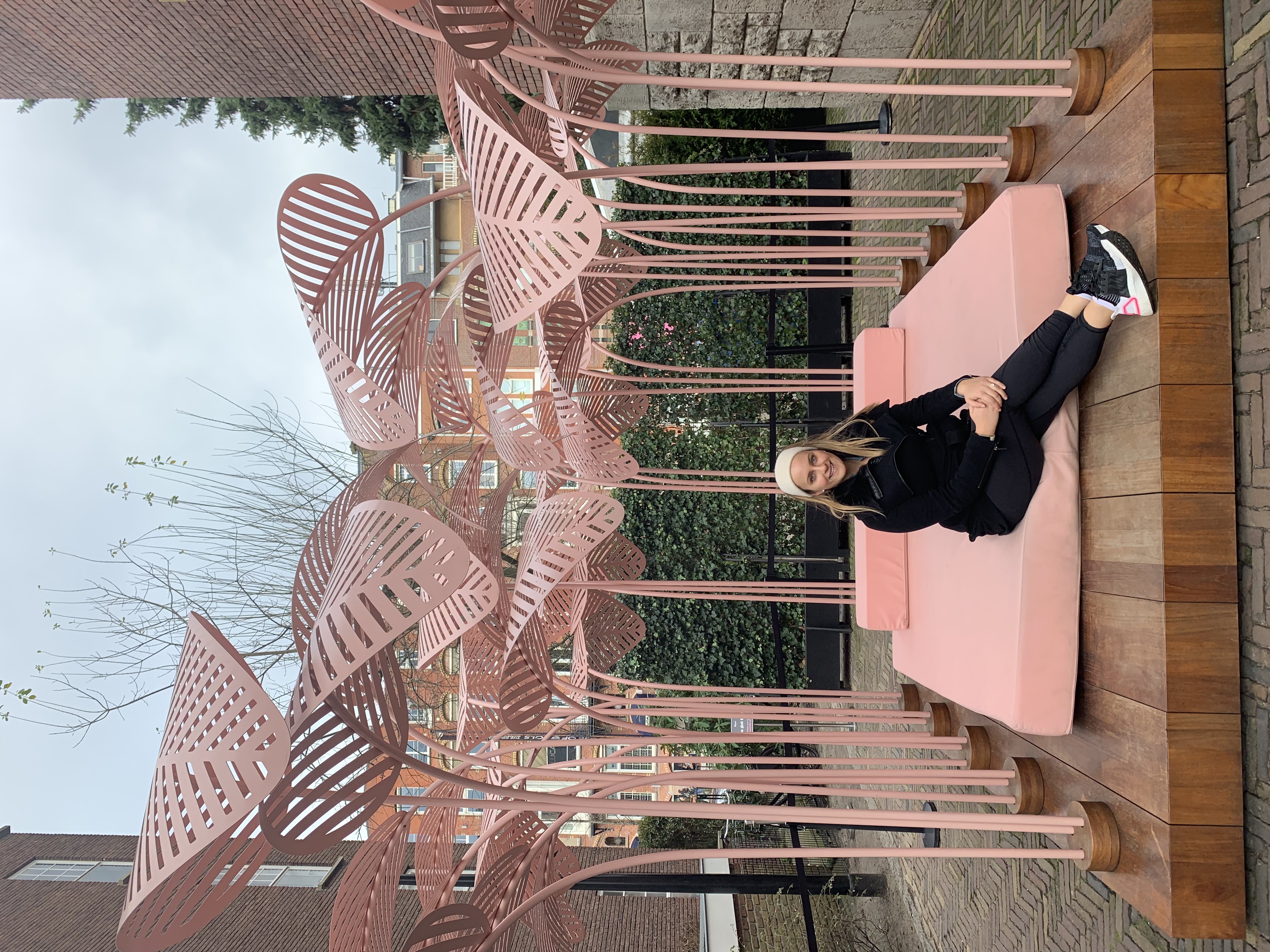 Sitting on pink chairs.