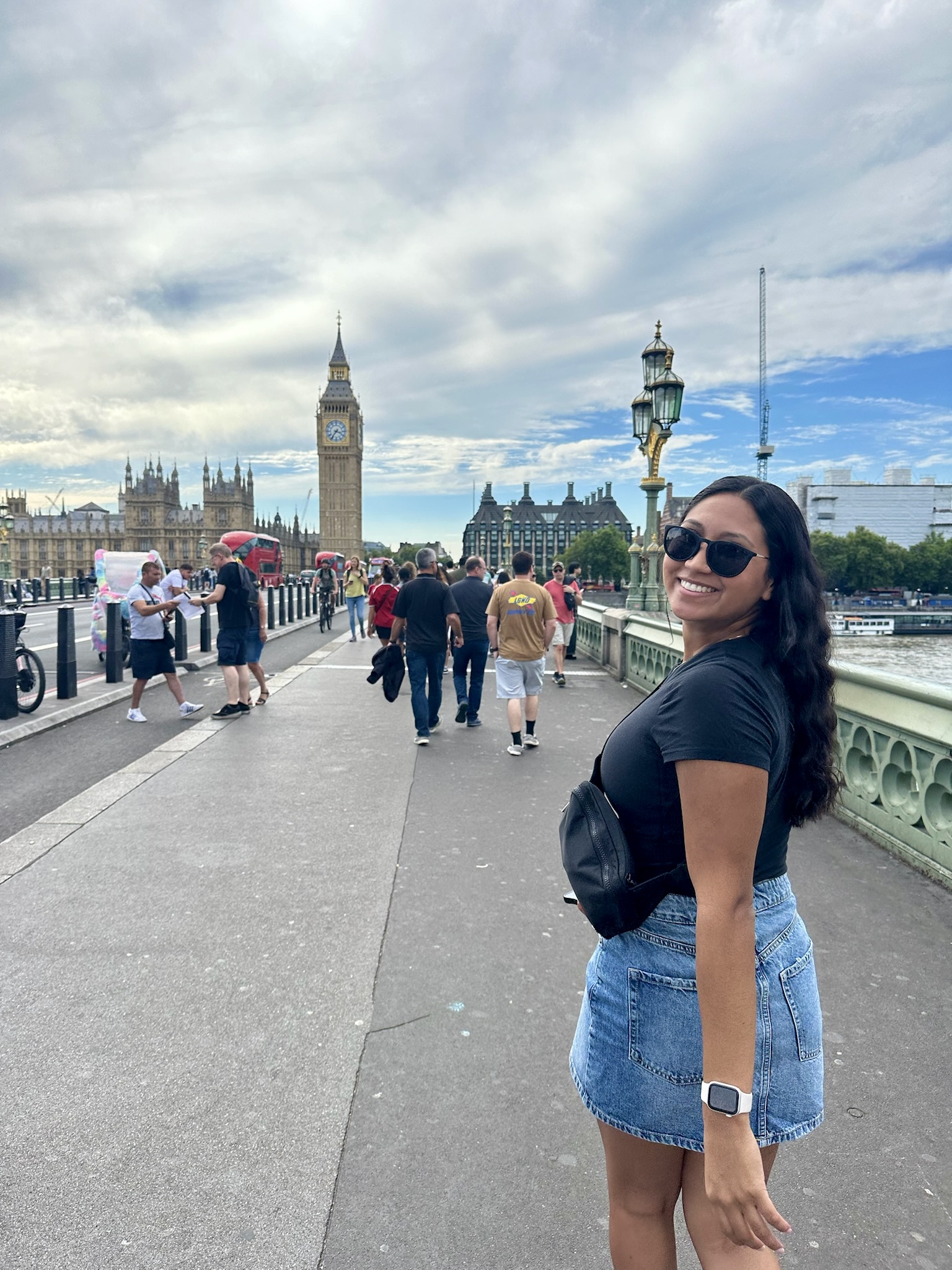 Advisor walking across a bridge in London with Big Ben visible in the background