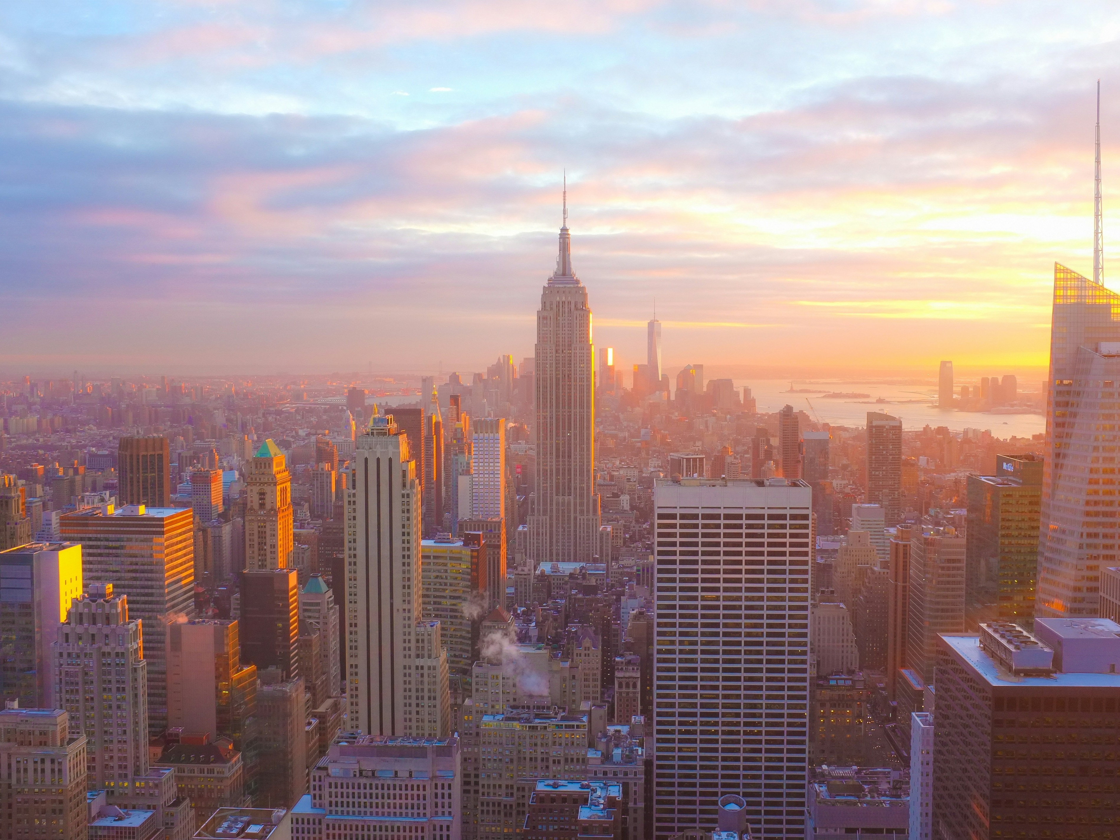 Aerial view of city buildings during a sunrise