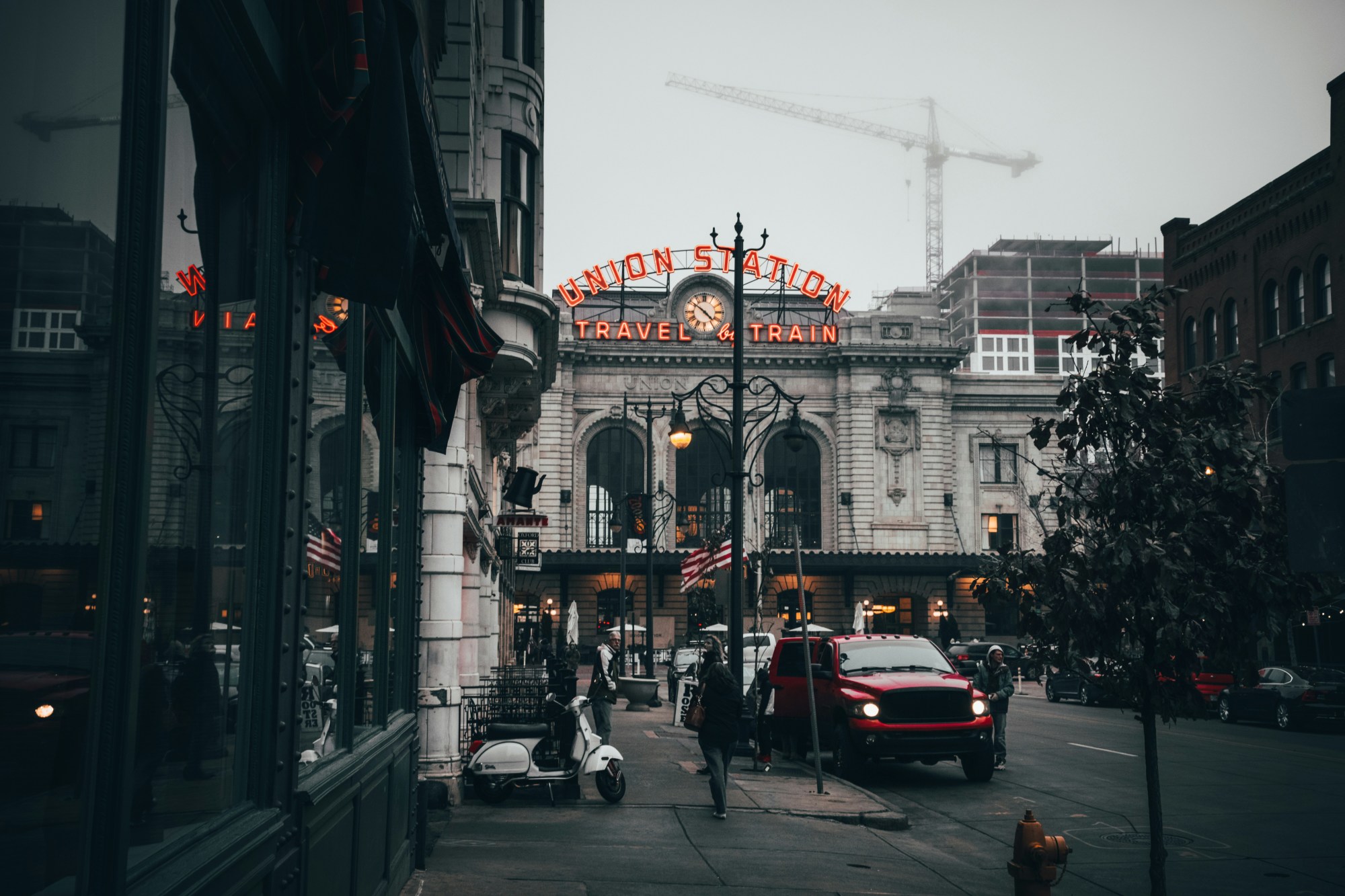 Building with "Union Station" lit in neon on a cloudy day.