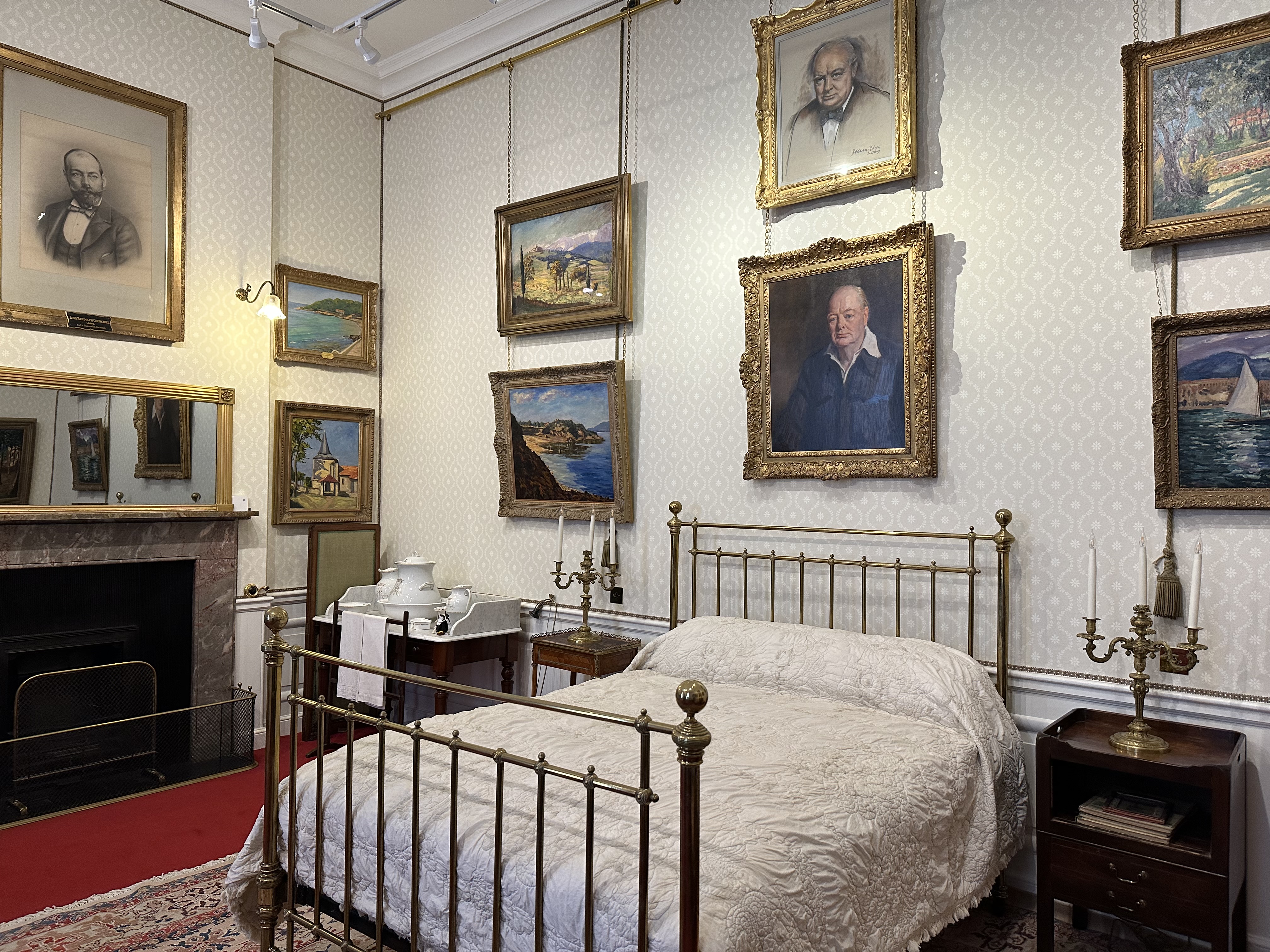 Interior of an ornate room with large wall hangings.