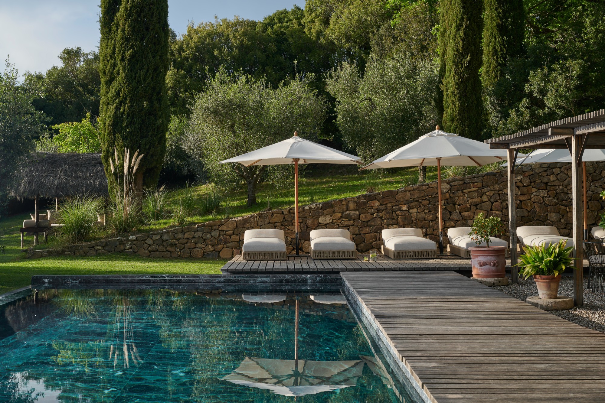 a sleek outdoor swimming pool in the Tuscan countryside