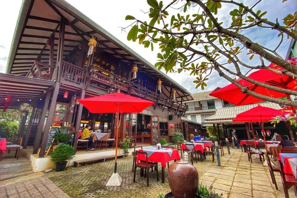 Red umbrellas outside a restaurant building during the daytime
