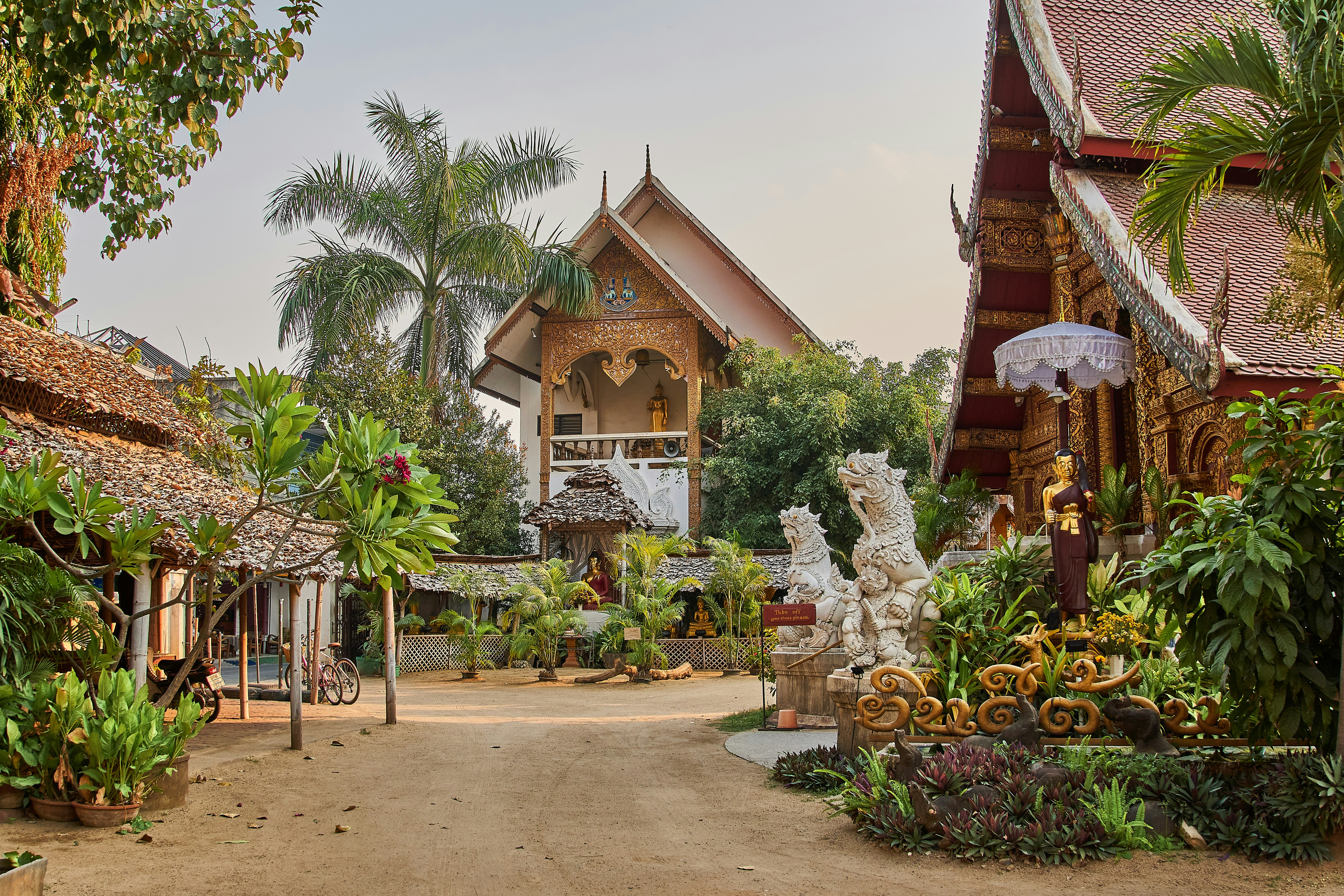 Temple grounds surrounded with lots of lush greenery during the daytime