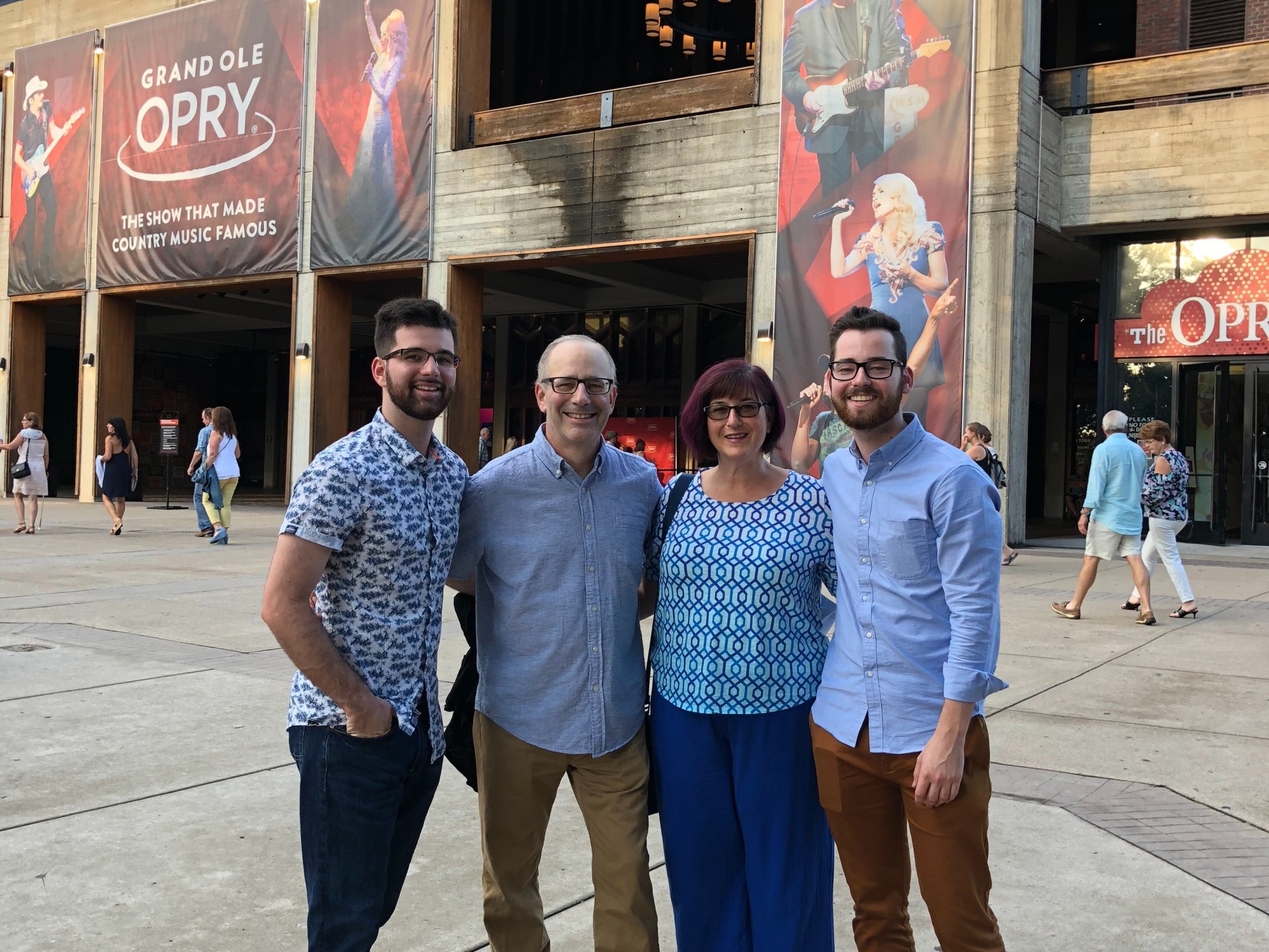 A group of people in front of a big building.