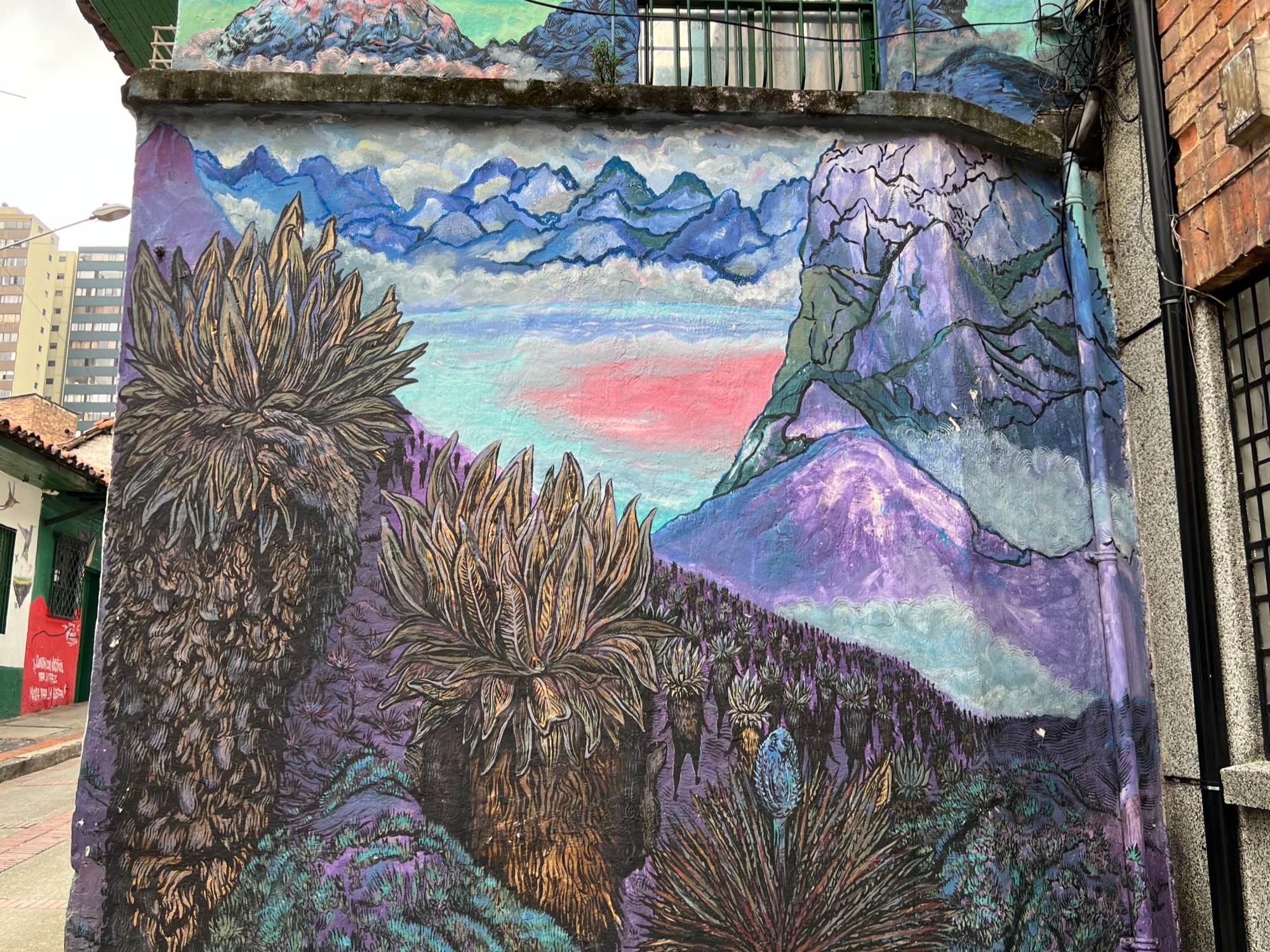 An art mural on a wall in a city street