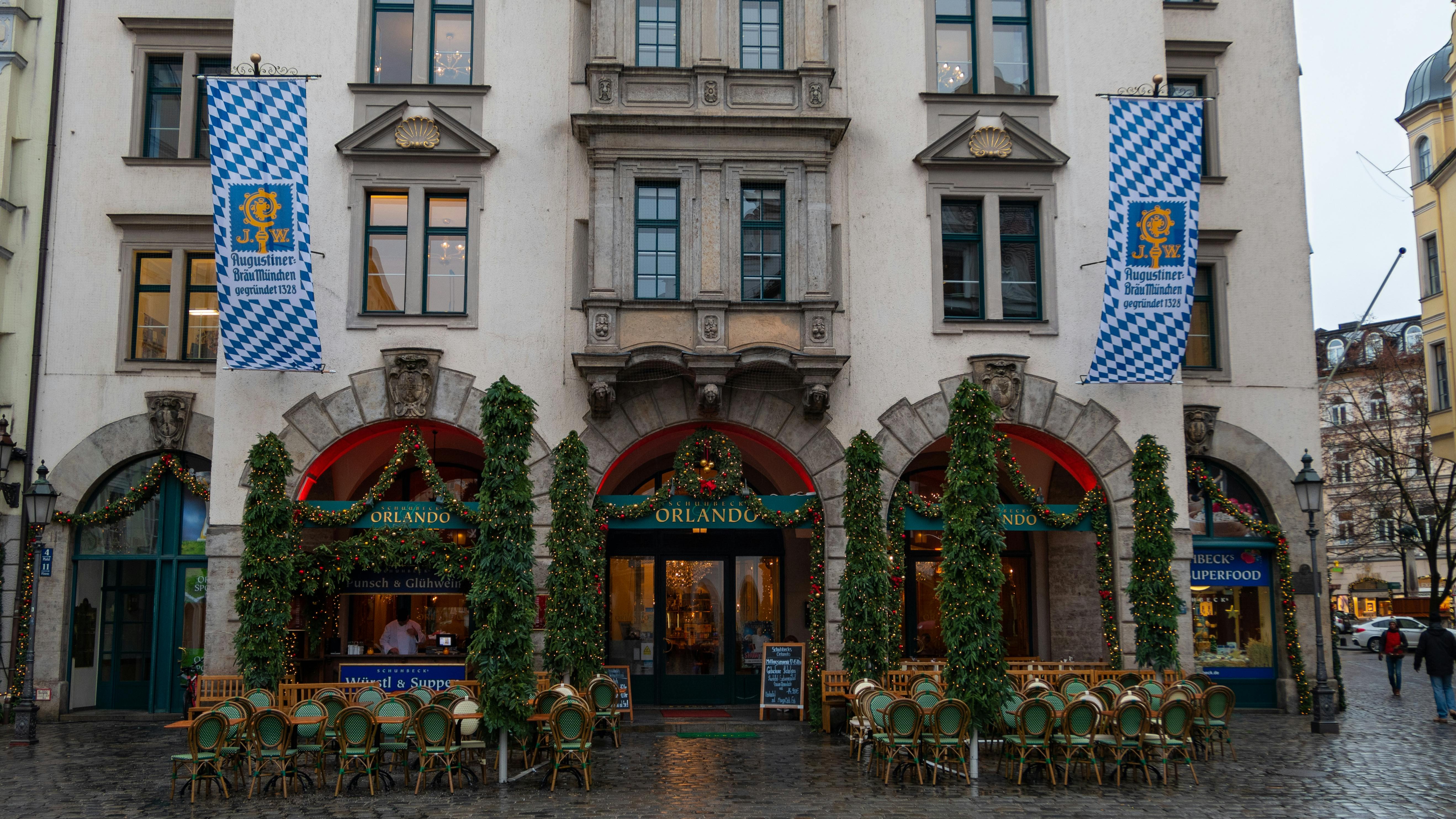 Exterior of a historic German building with blue flags.