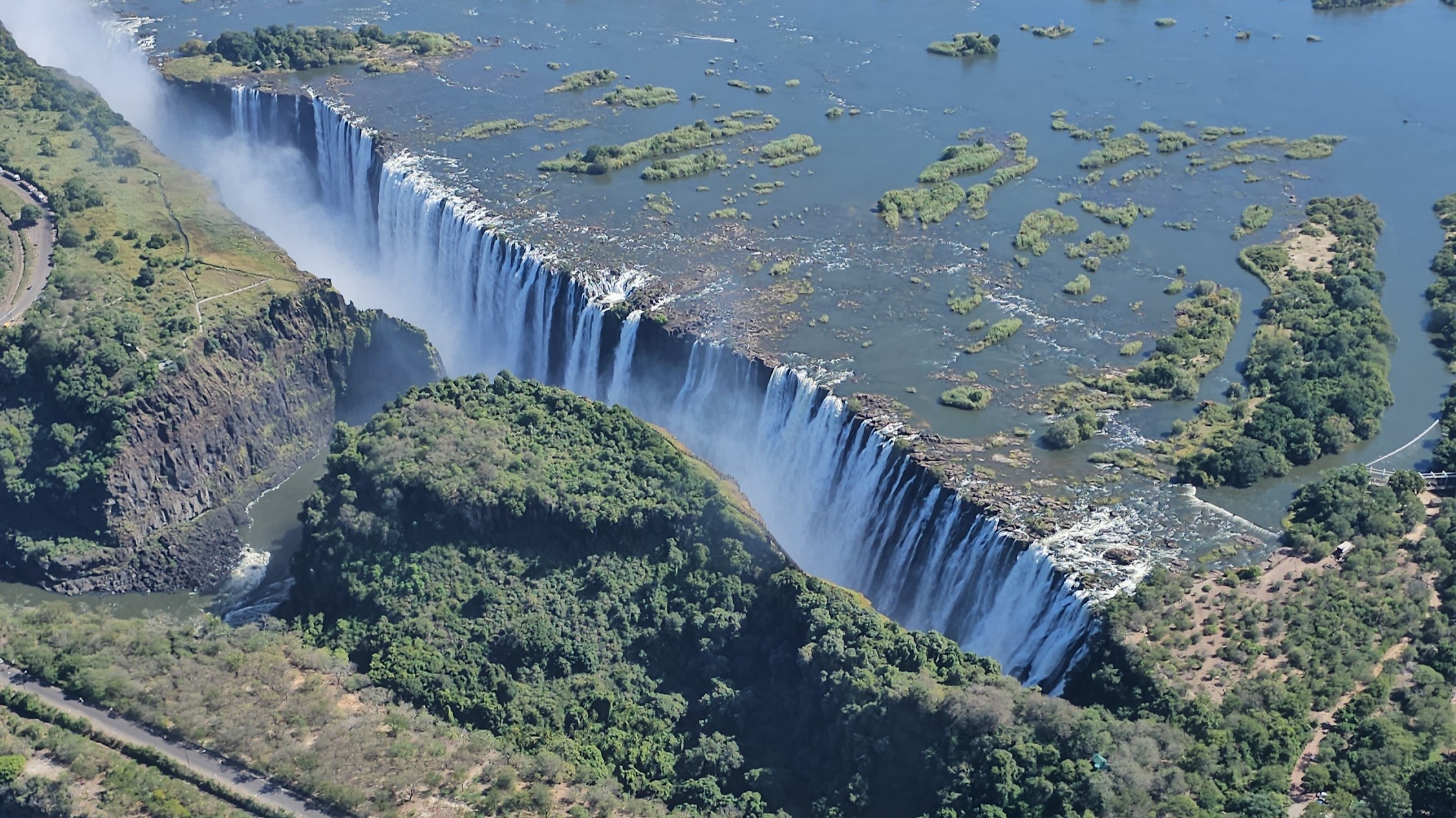 Aerial view of an enormous waterfall.