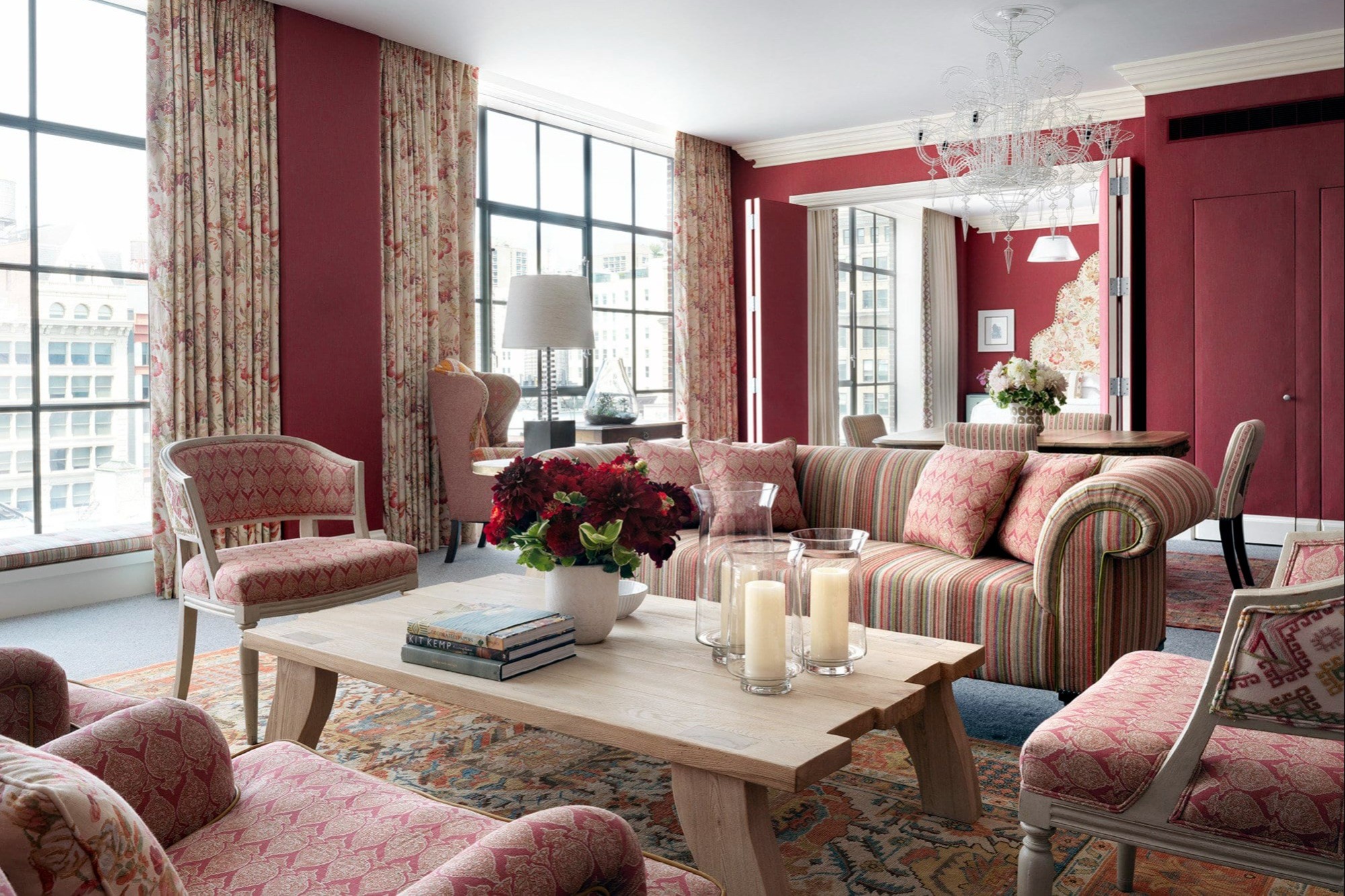 An elegant, even feminine design permeates a living space attached to a suite at Crosby Street Hotel