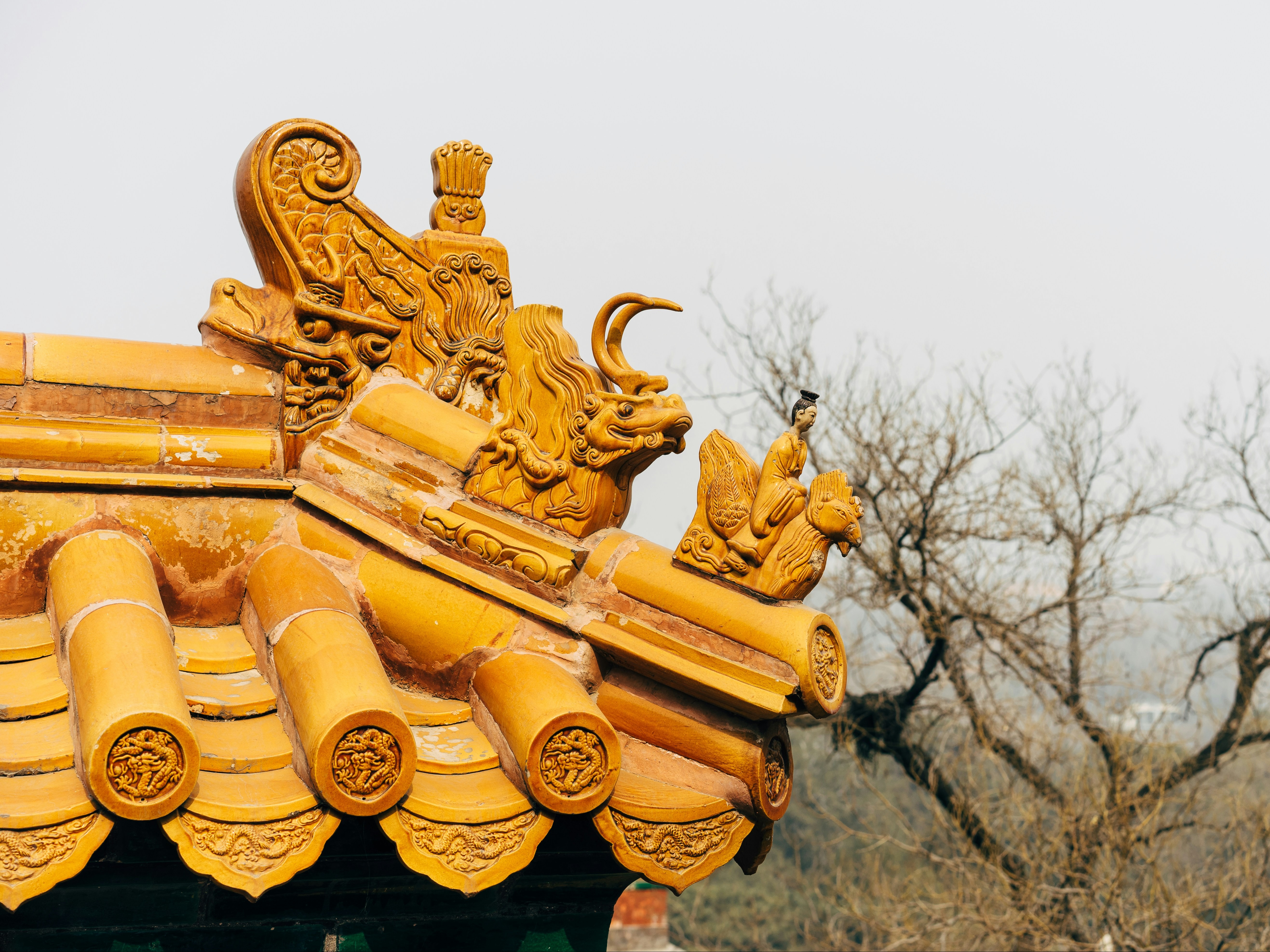 A close of photo of an intricate, yellow roof