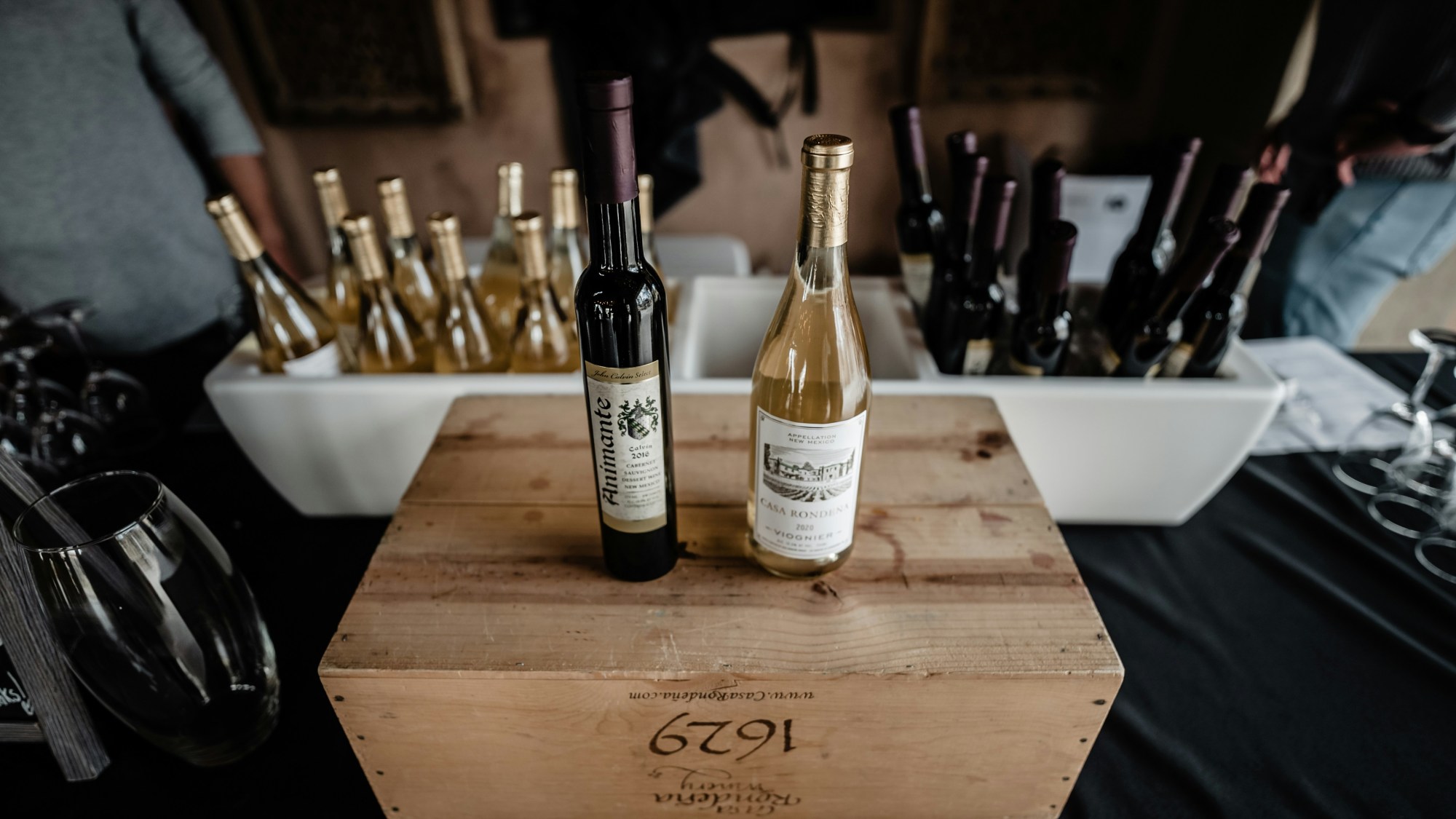 Wine bottles on a wooden box.