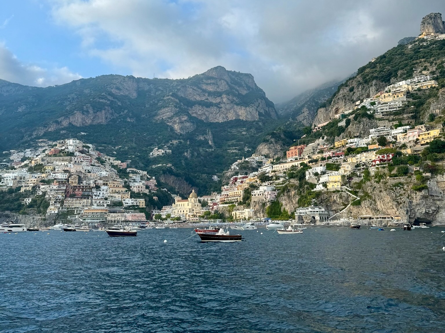 A cliffside next to a body of water during the daytime