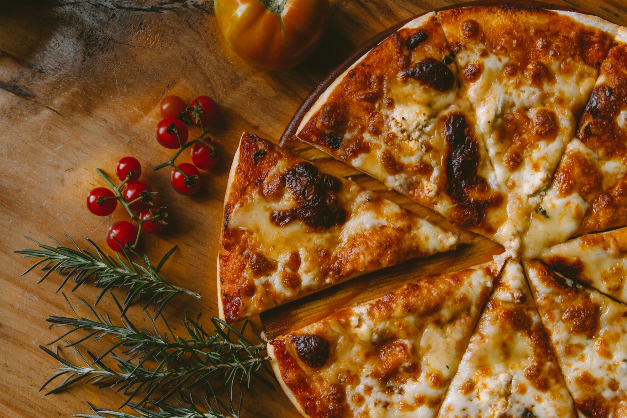 Pizza on a wooden block