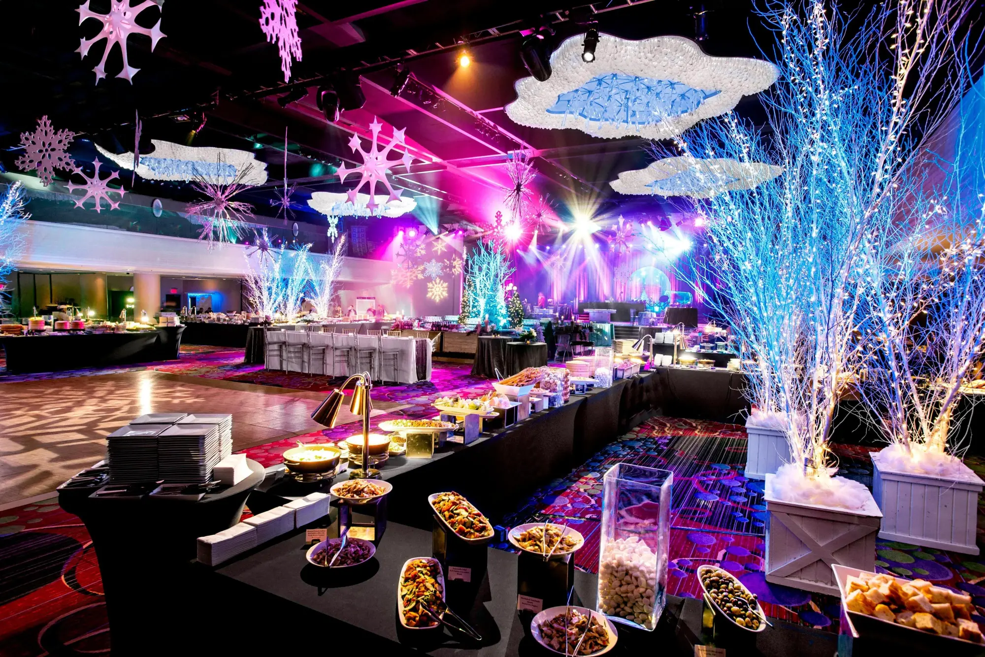 Neon lighting, a nice buffet and various winter-themed decor fill an event space