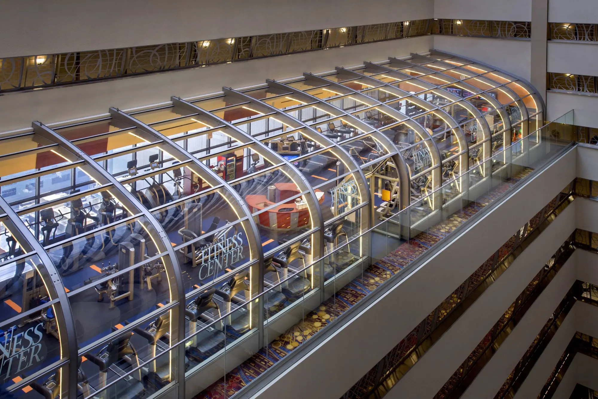An exterior shot of New York Mariott Marquis' fitness center, which offers views of the interior structure and outside